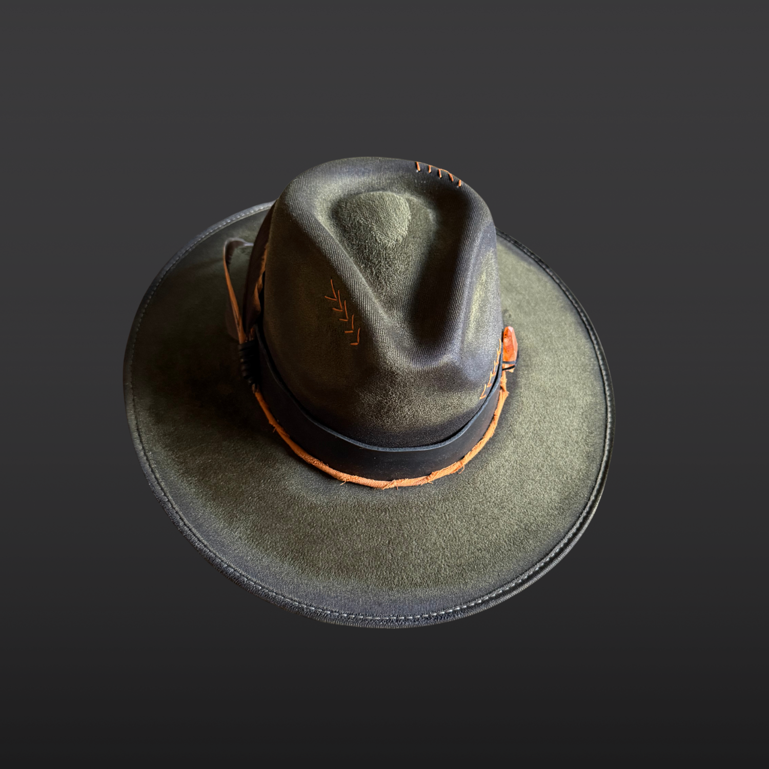 Top profile of the Solar Path Fedora Hat showing tangerine quartz double point crystal, black and orange rooster feathers, and leather band details.