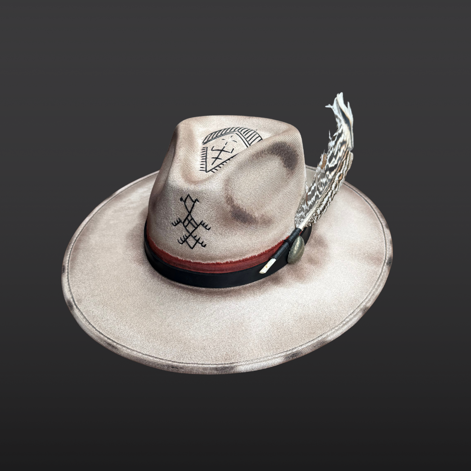 Right side view of Ember Guardian wide brim fedora hat showing pyrite crystal, turkey feather, and symbolic embroidery details.