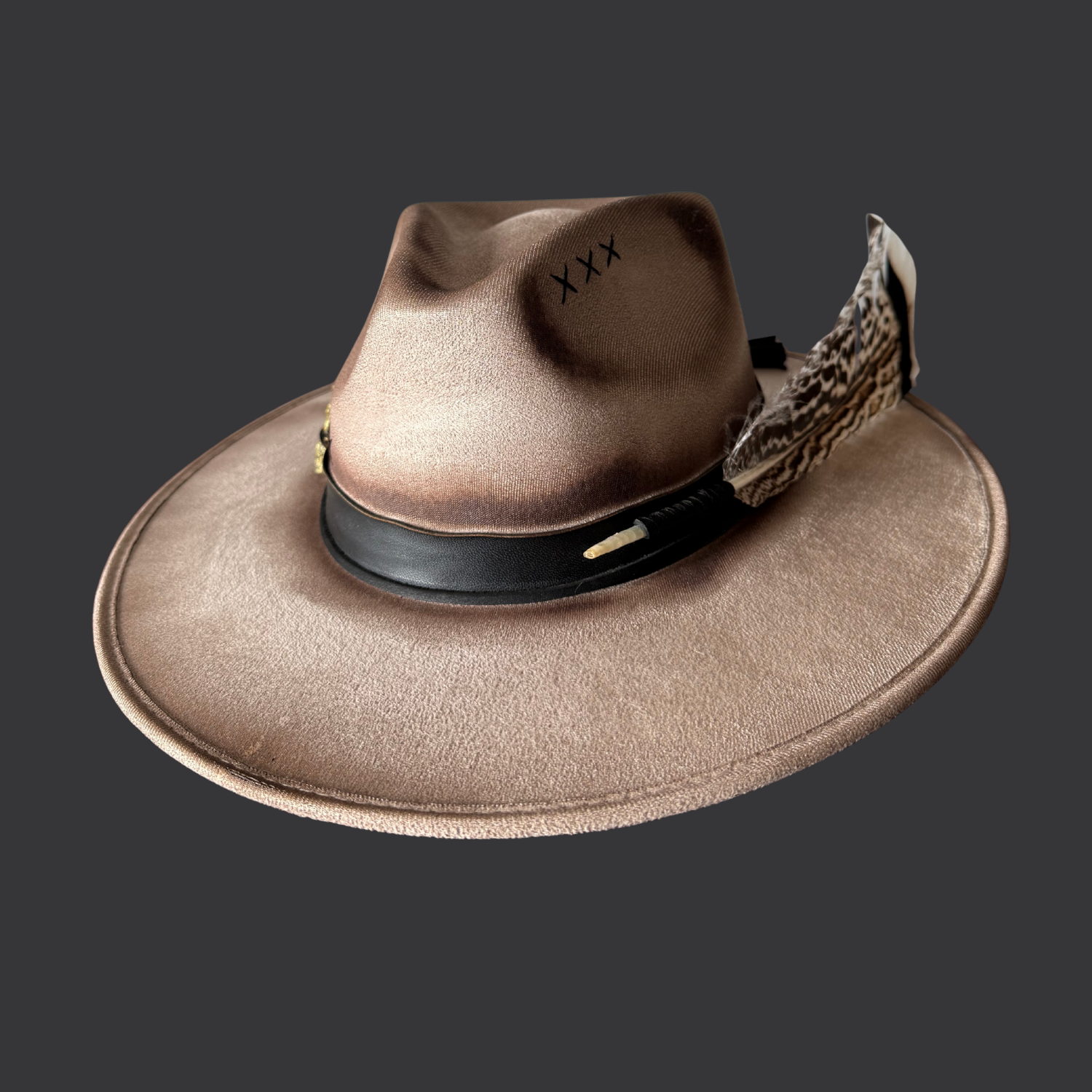 Front side view of khaki wide-brim fedora hat with chalcopyrite crystal and black leather tassels