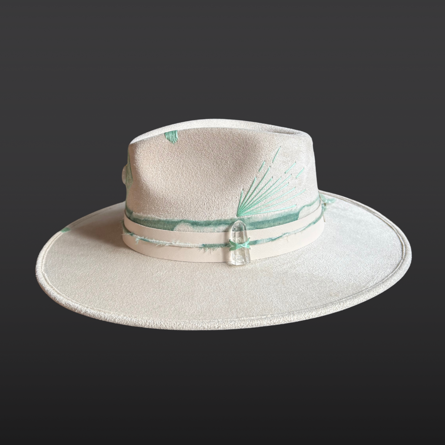 Right side of ivory vegan suede boho fedora with teal hand-embroidered details