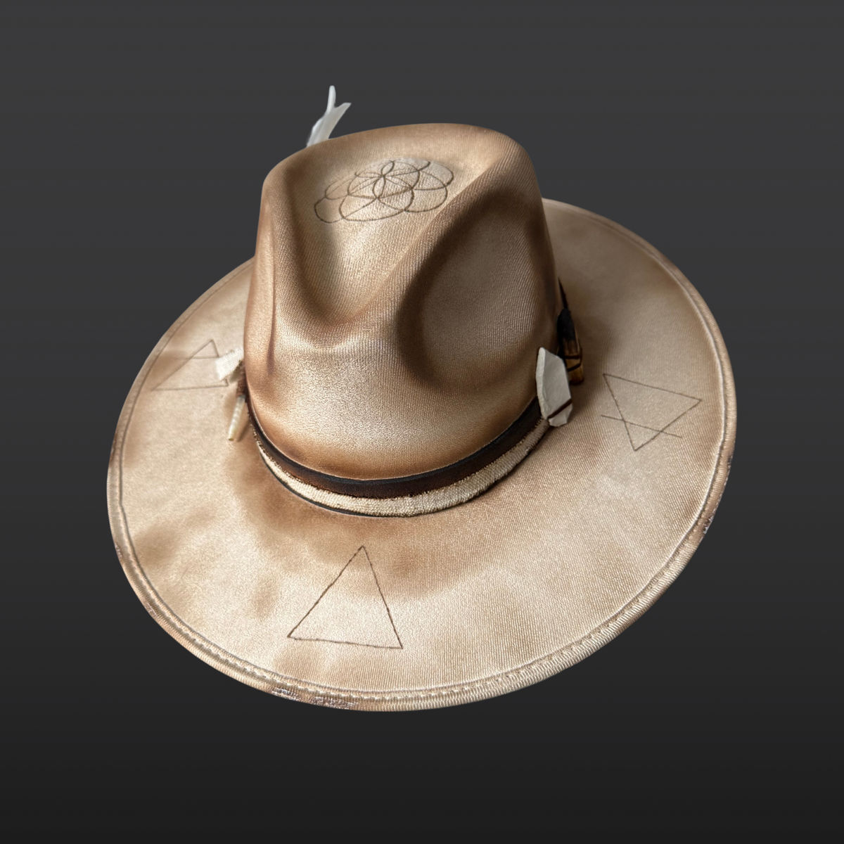 Angled top side view of Elemental Harmony cream fedora showing Seed of Life and Four Elements pyrography