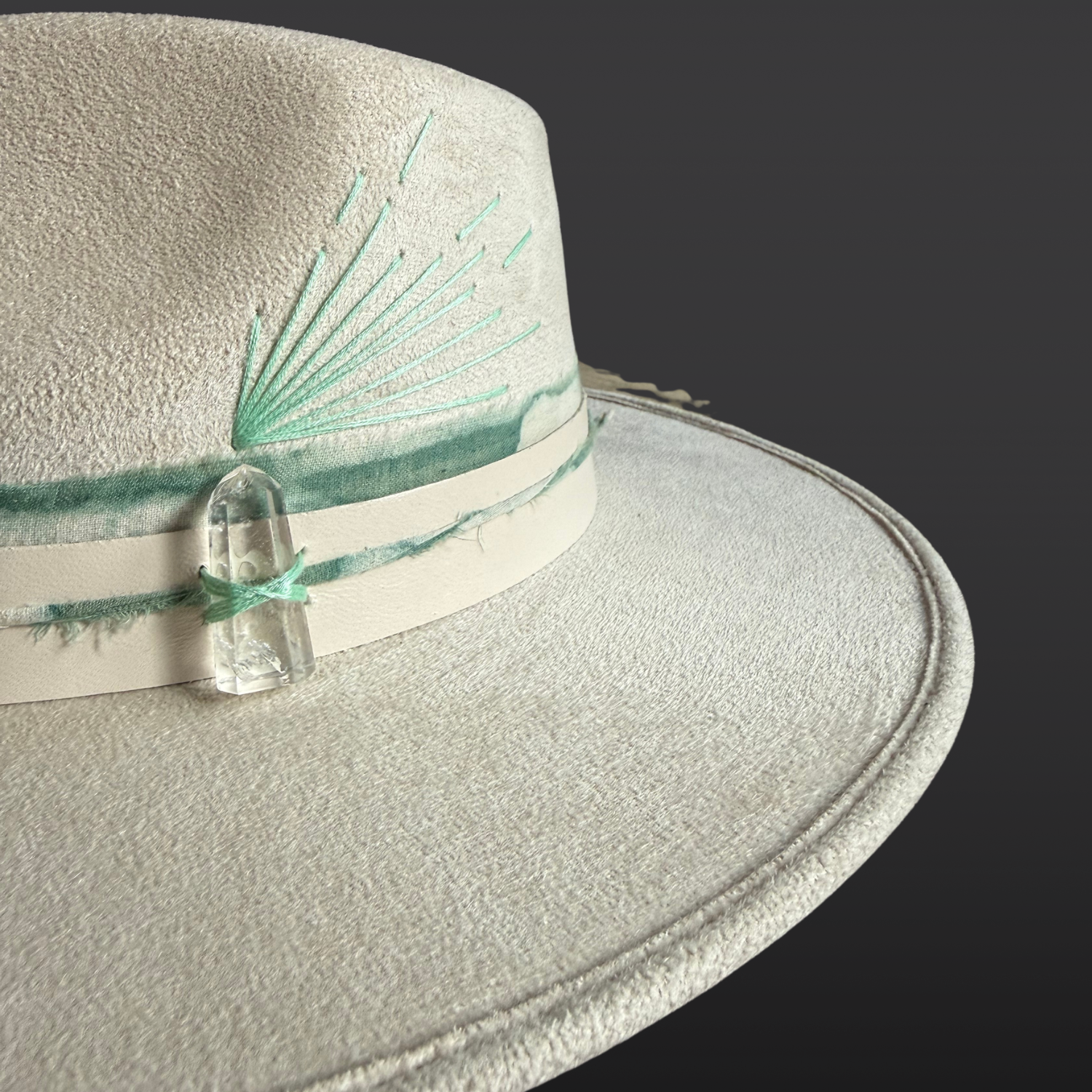 Close-up of genuine Clear Quartz crystal on the side of the Lumina artisan fedora