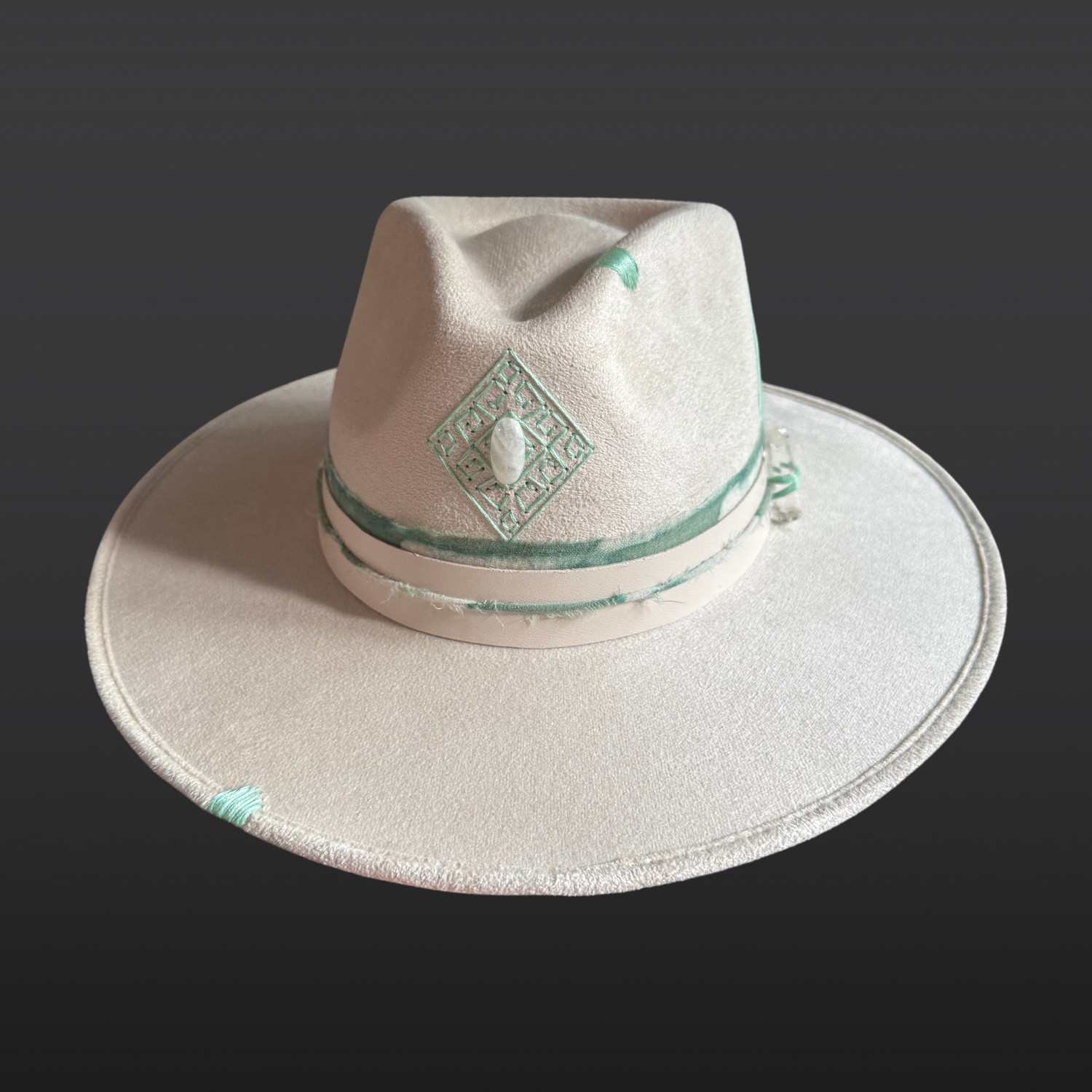 Front view of ivory wide brim fedora featuring a hand-embroidered diamond design with genuine Moonstone