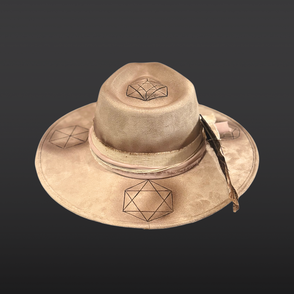 Back view of Harmonia boho fedora hat showing rustic pink and cream fabric band and feather detail