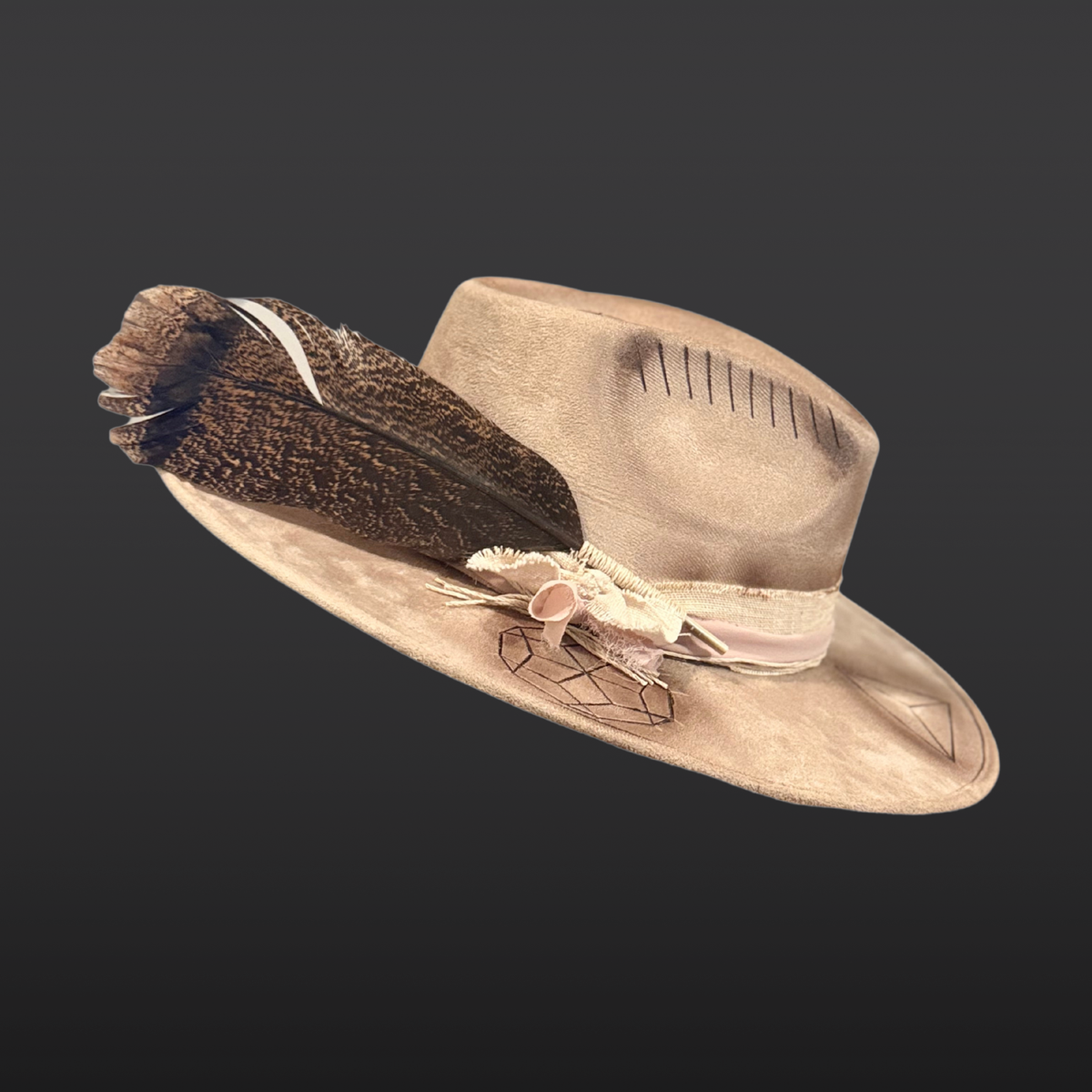 Side view of Harmonia wide brim fedora hat featuring hand-burned sacred geometry and turkey feather