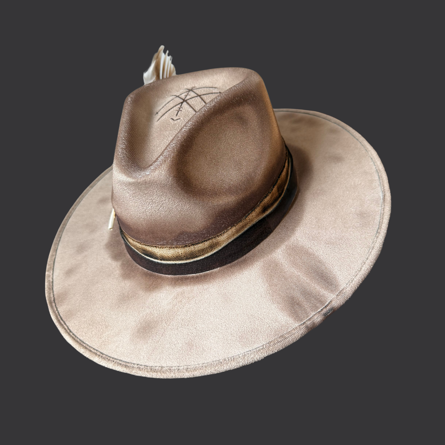 Right side view of khaki fedora hat with pyrography detailing and pyrite accent