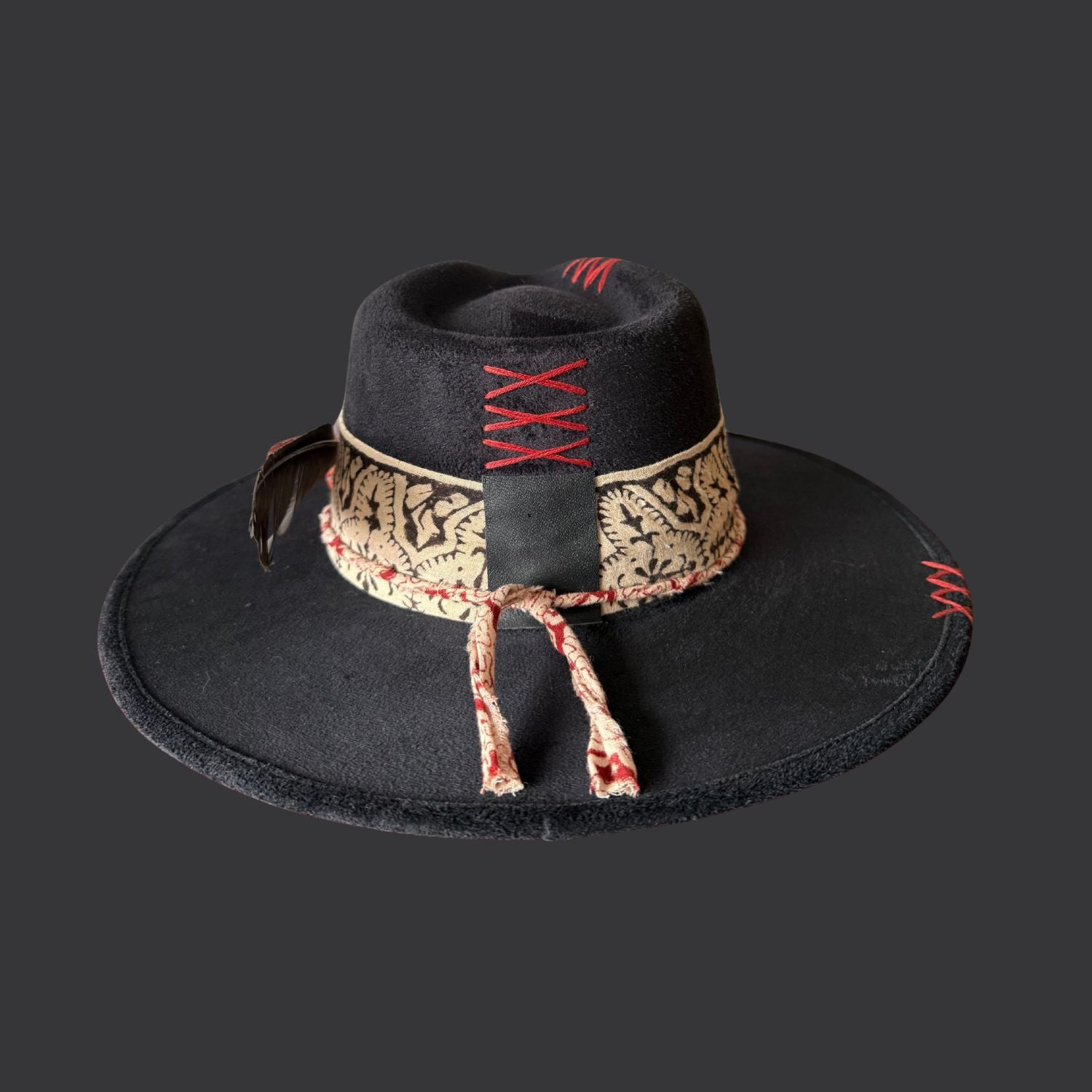 Back view of one of a kind black fedora hat with red jasper, embroidered details, and feather accents