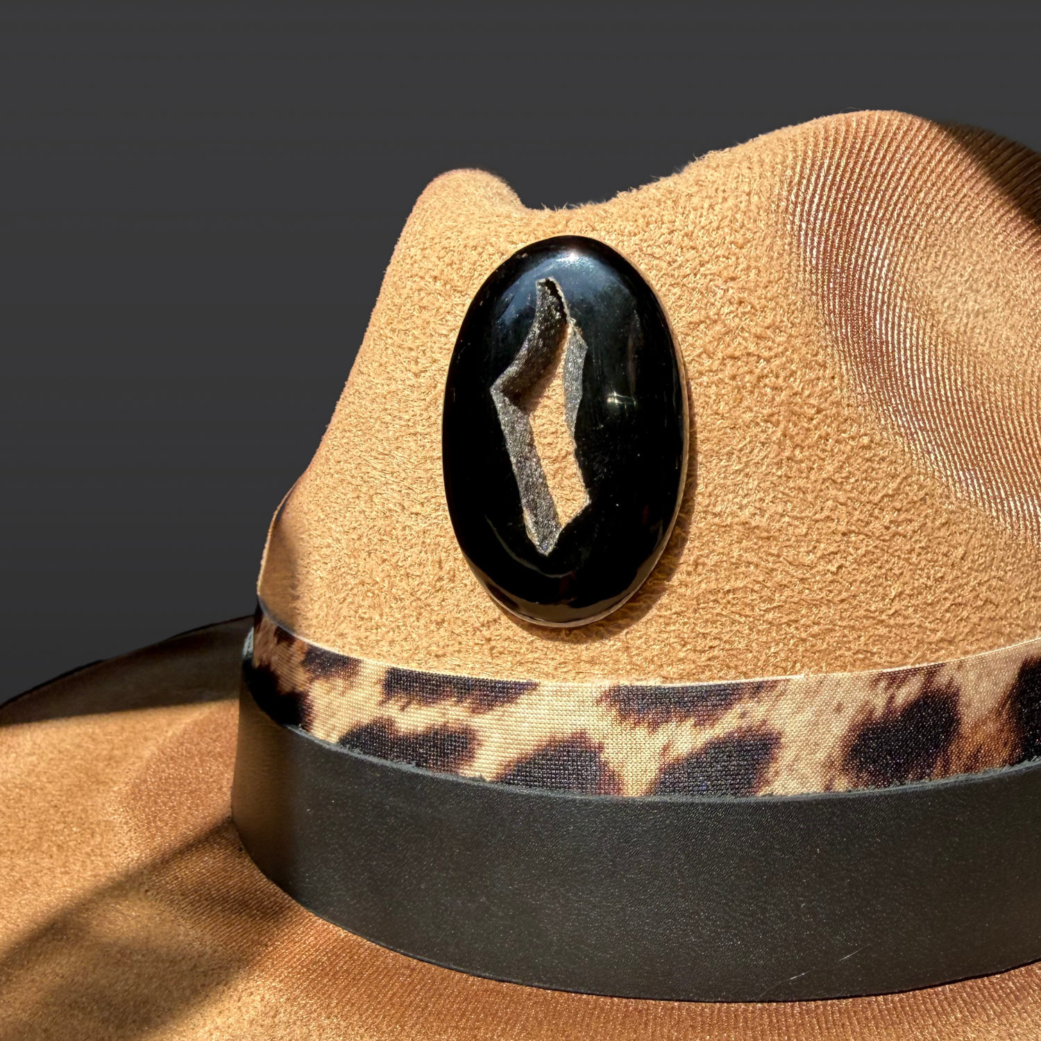 Close-up of the black agate onyx druzy, and animal-print leather accents on the Shadow Jaguar fedora.