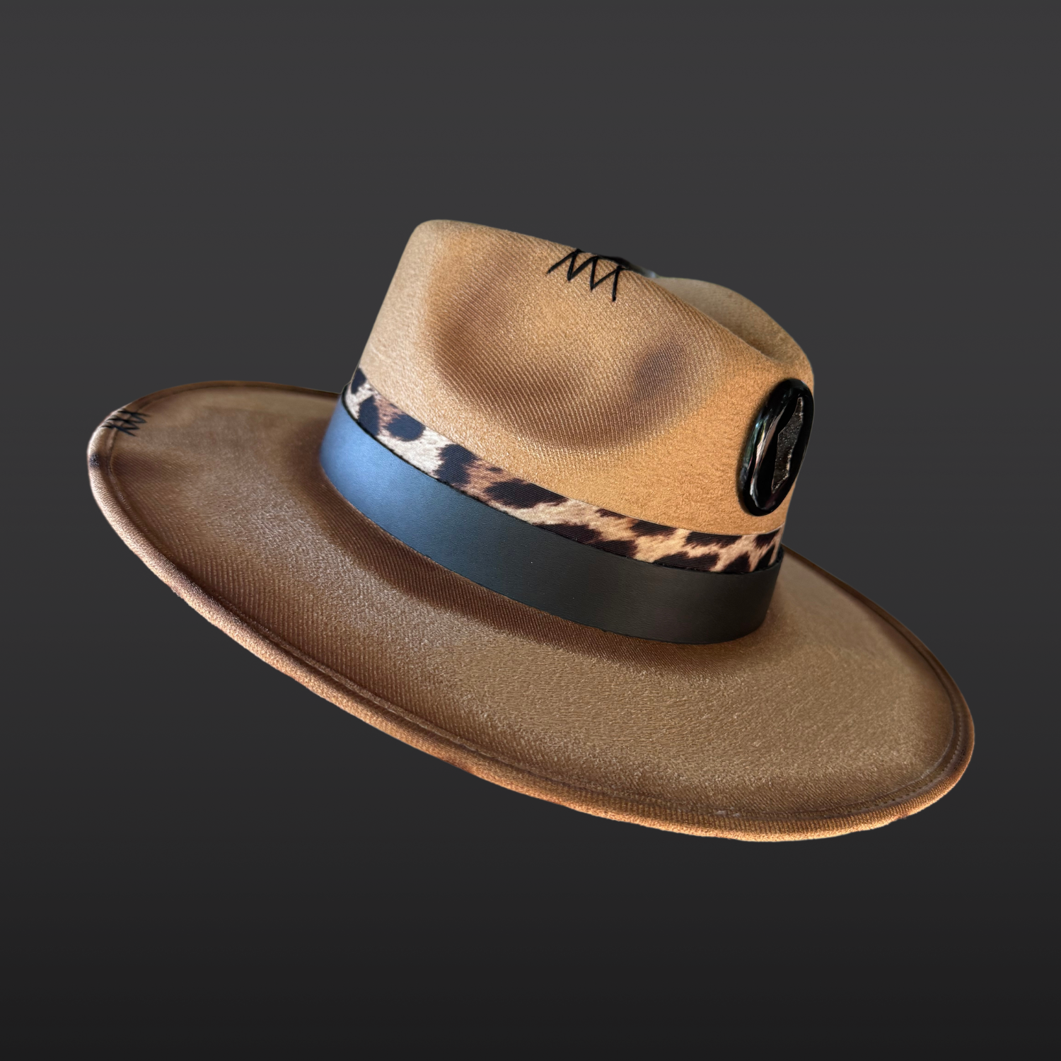 Side view of the Shadow Jaguar fedora showcasing the black agate onyx druzy, crow feathers, and layered leather bands.