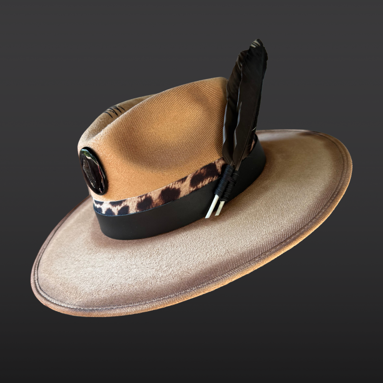 Camel vegan suede fedora with hand-burned designs and bold animal-print details.