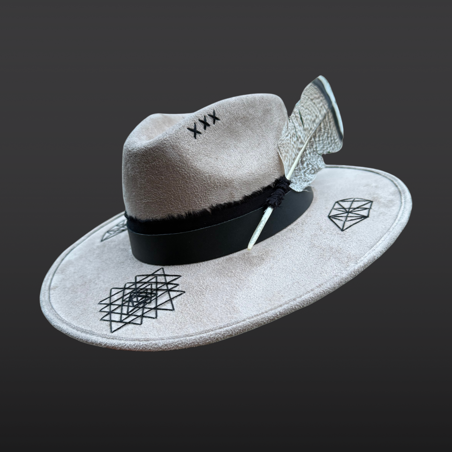 Angled front right view of Rooted Light fedora showing hand embroidered Sri Yantra, leather band and crystal embellishments.