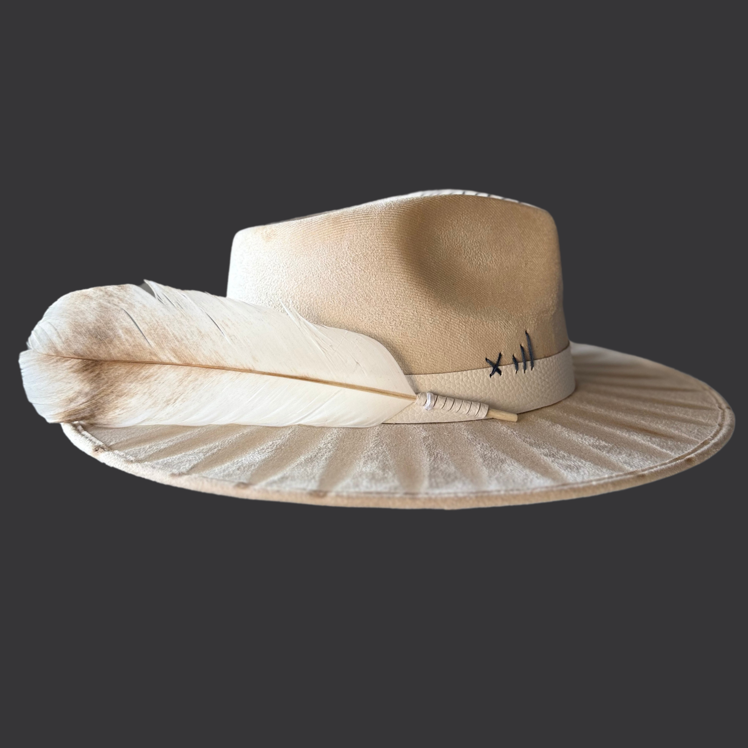 Ivory fedora boho hat with bison tooth, blue kyanite, and palo santo/ left view