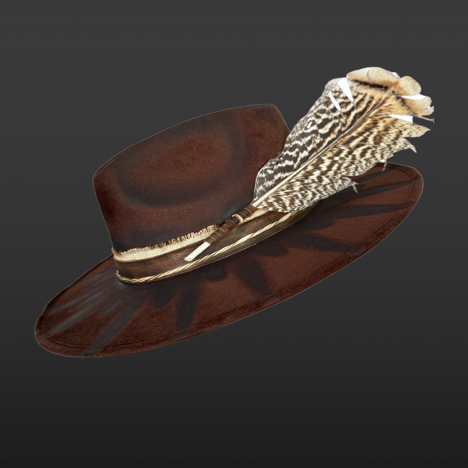 Left Side profile of brown wide brim fedora hat showing feather embellishment, torch-burned detailing, and handcrafted boho design