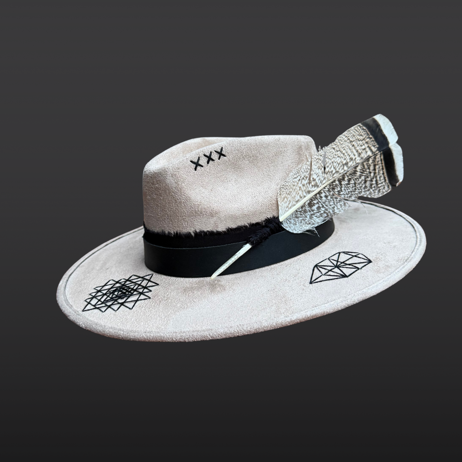 Left side view of Rooted Light fedora with hand embroidered Tree of Life symbol, black leather band and organic cotton band.