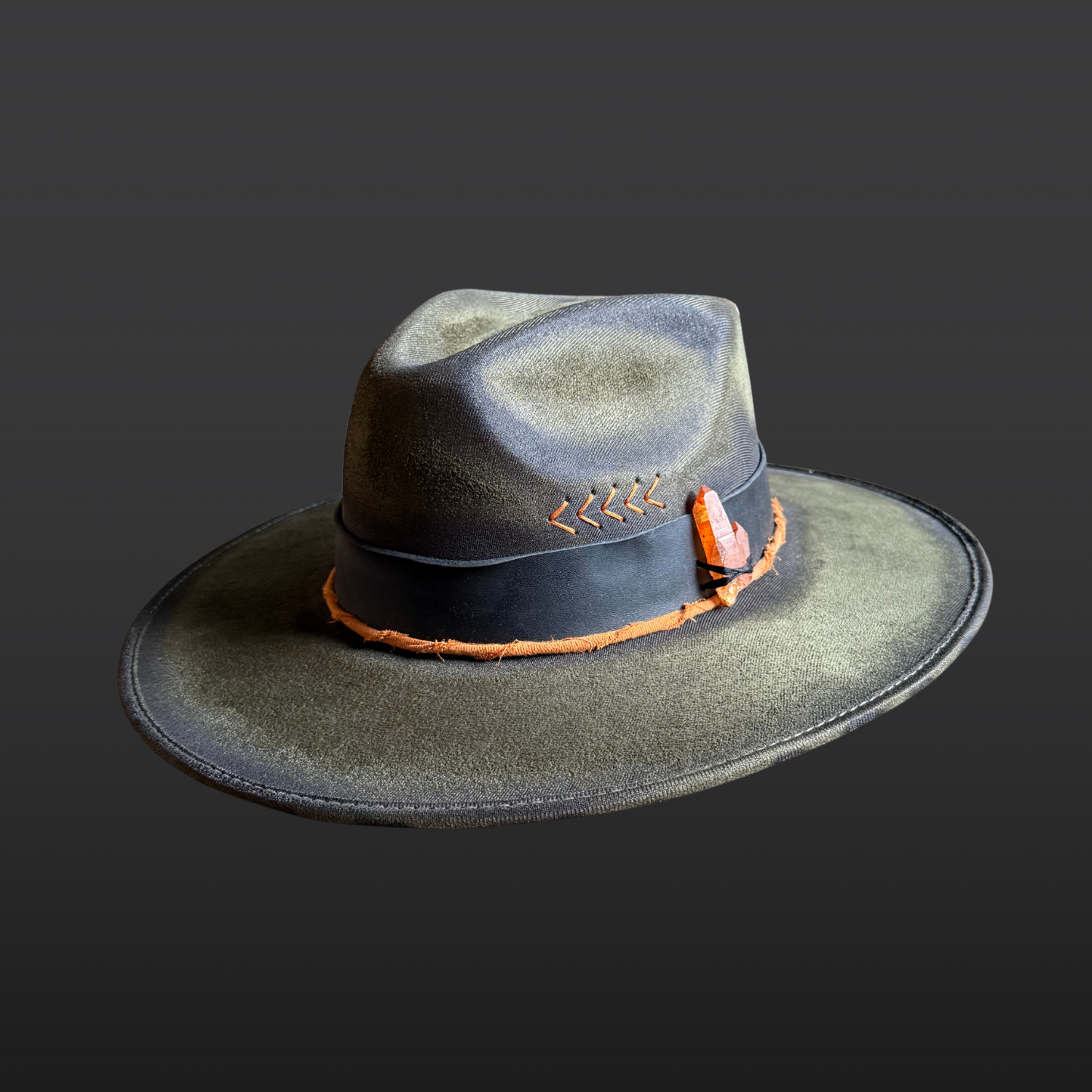 Solar Path Fedora Hat in forest green vegan suede featuring hand-torched details, black leather band, orange arrow accents, and tangerine quartz crystal.