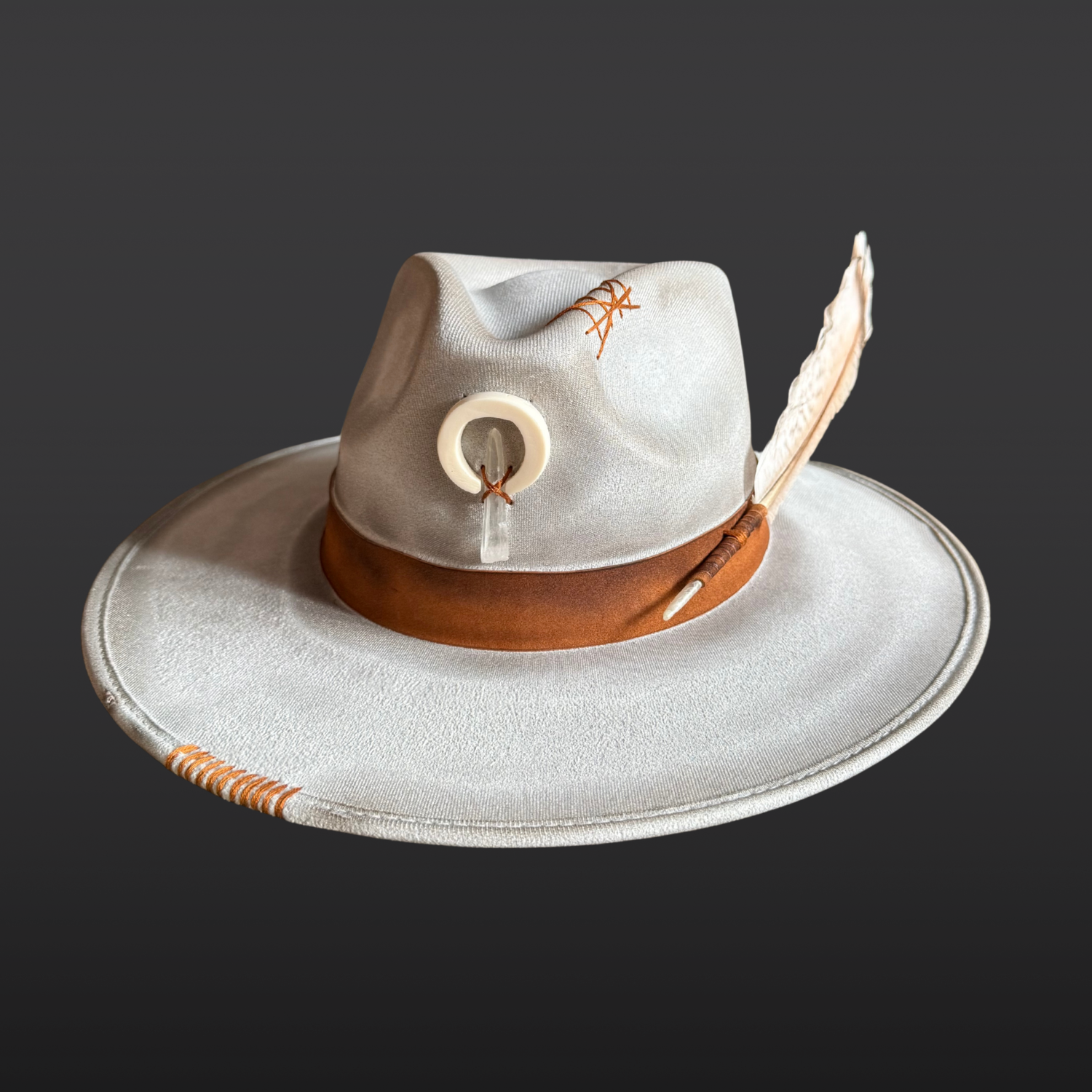 Front view of light grey artisan fedora featuring a naturally shed deer antler and Lemurian Quartz crystal