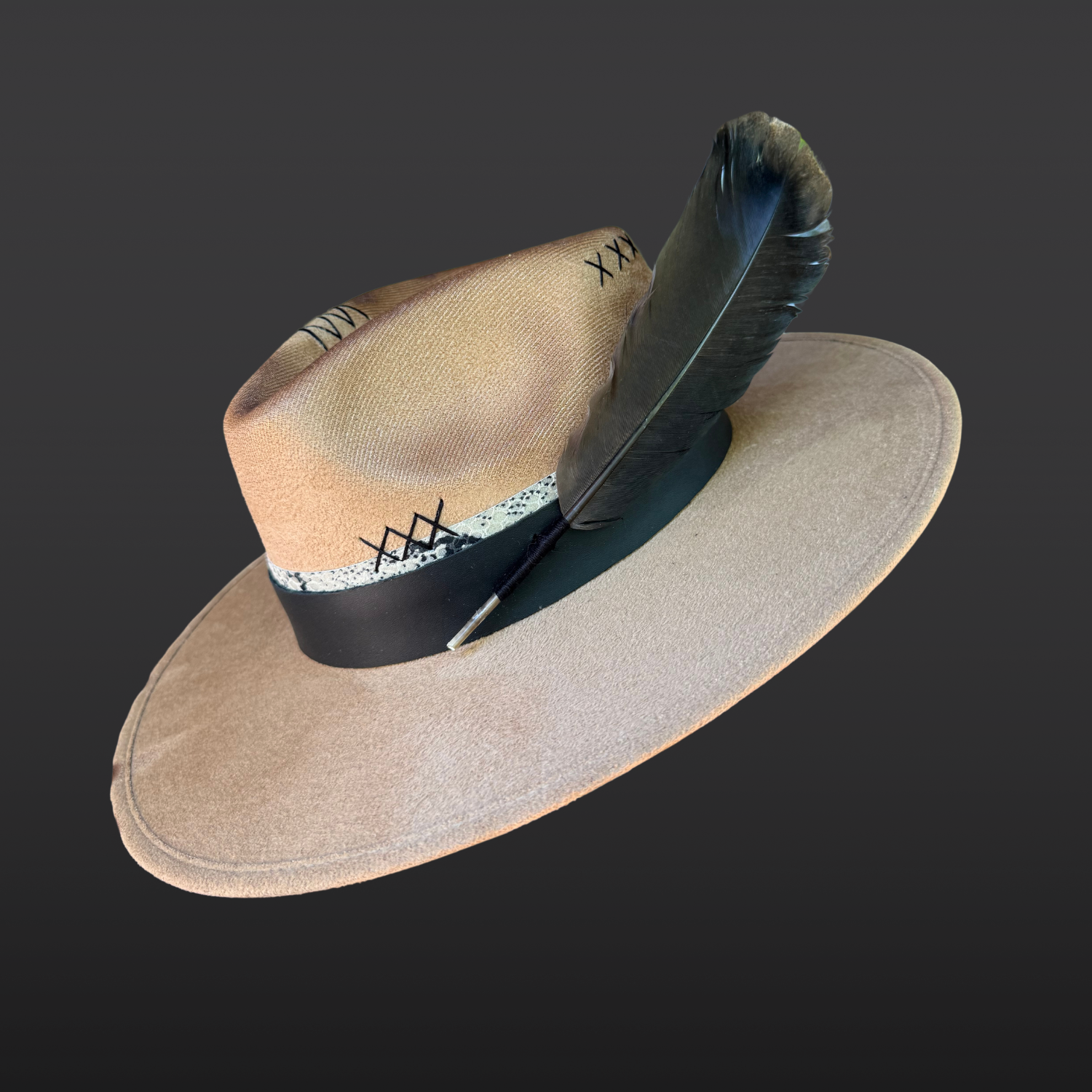 Left side of camel vegan suede fedora with black leather band, serpent print leather accent, and wide brim silhouette.