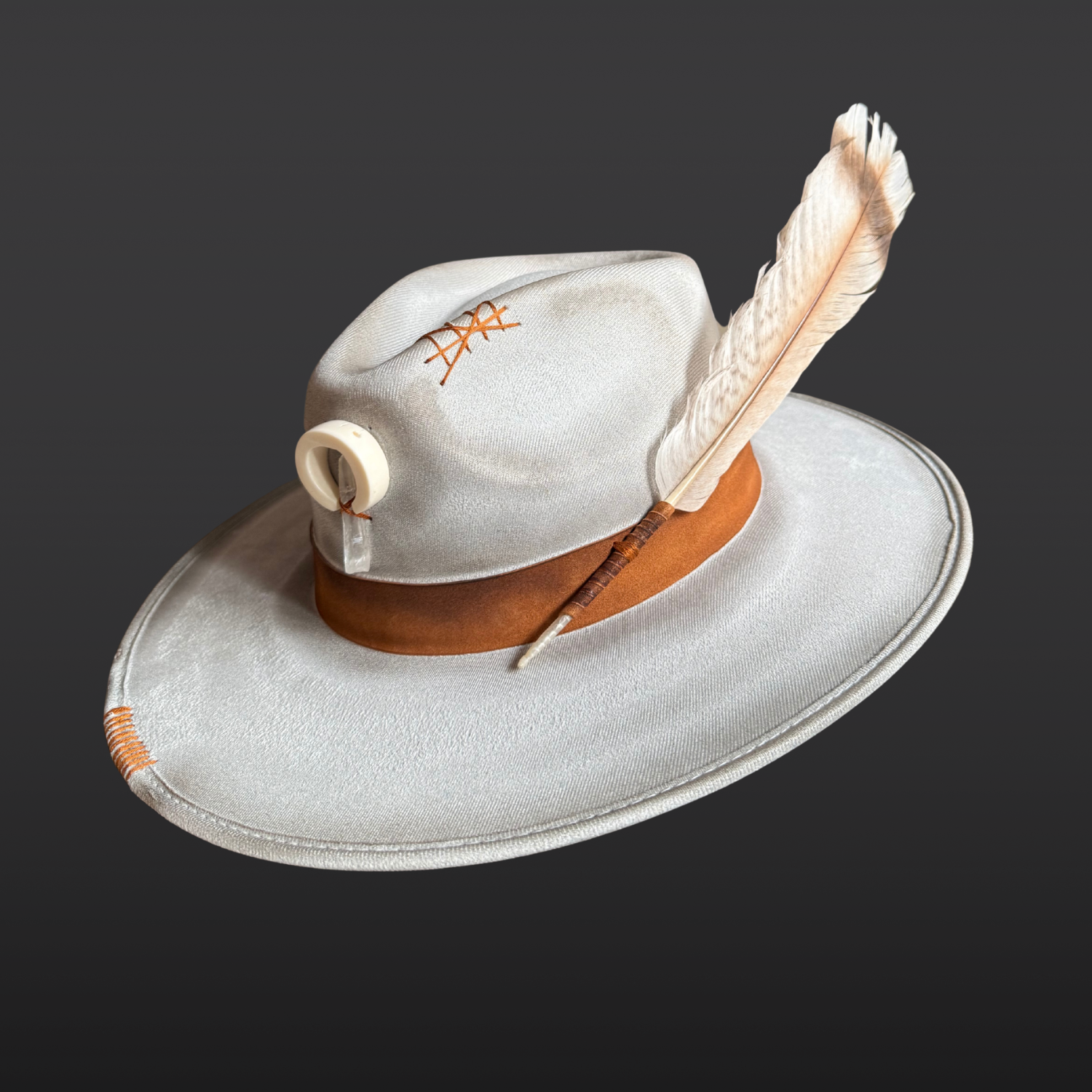 Front view of light grey artisan fedora featuring a naturally shed deer antler and Lemurian Quartz crystal