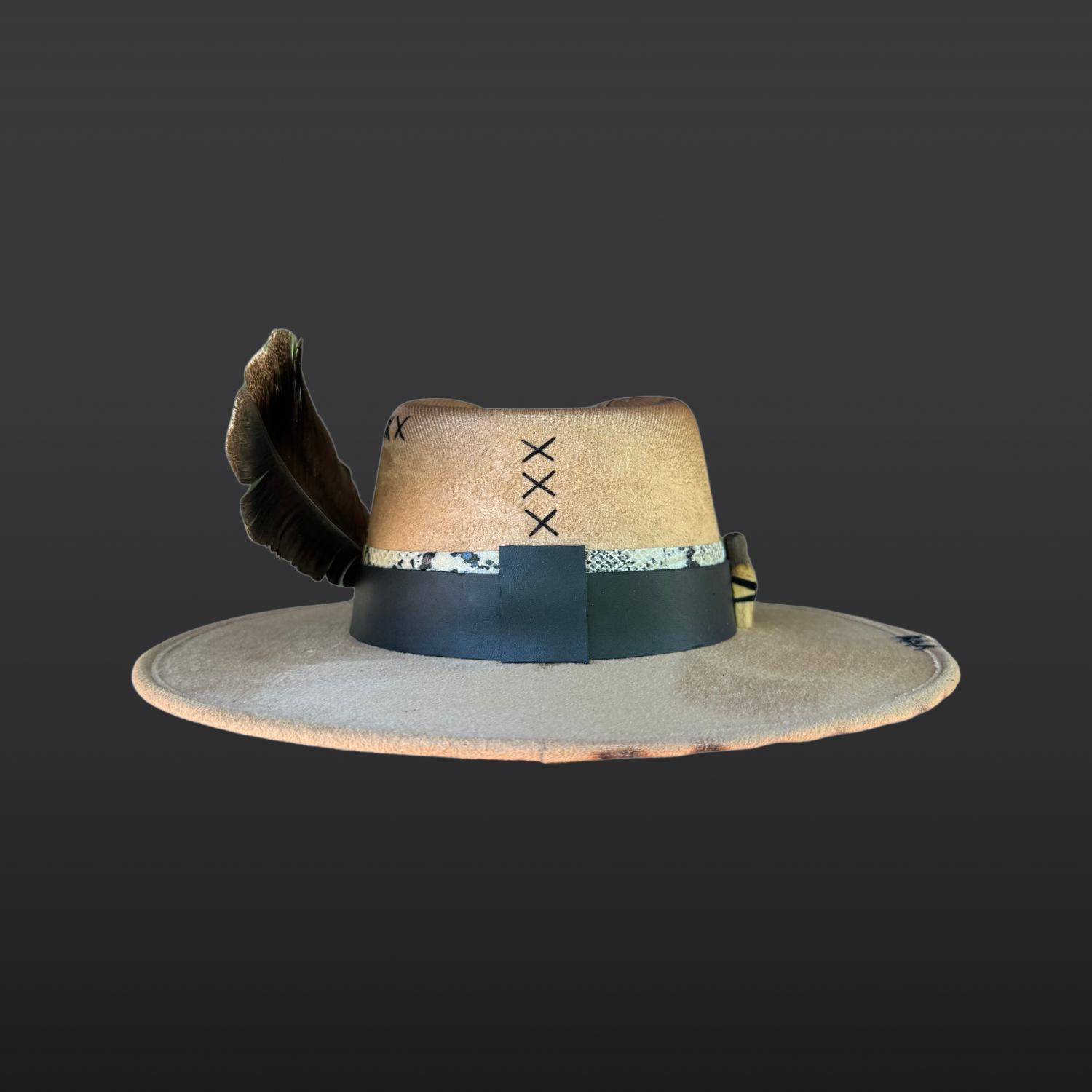 Back view of camel wide brim fedora featuring black leather band, serpent print leather accent, and handcrafted finish.