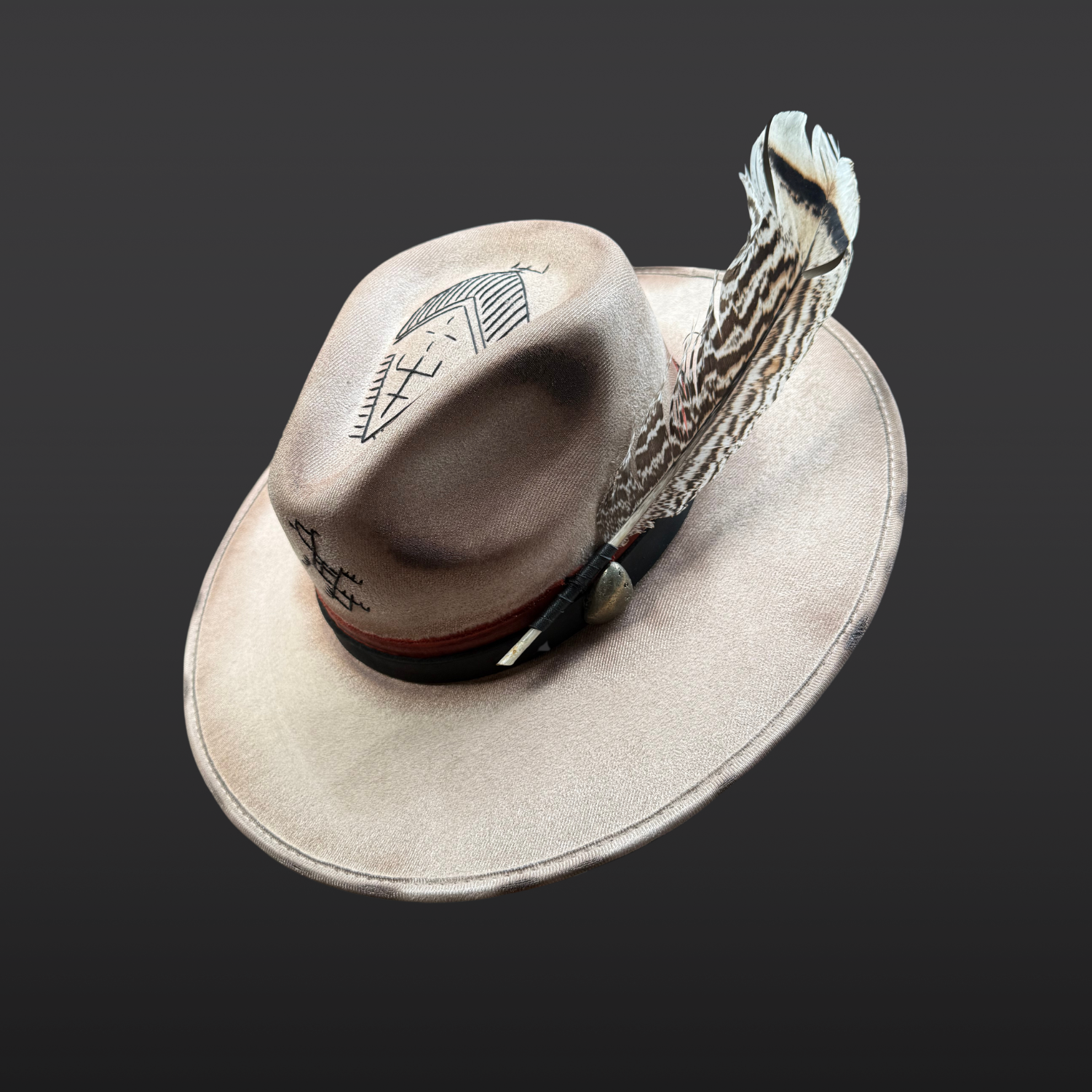 Angled side view of Ember Guardian wide brim fedora hat showing pyrite crystal, turkey feather, and symbolic embroidery details.