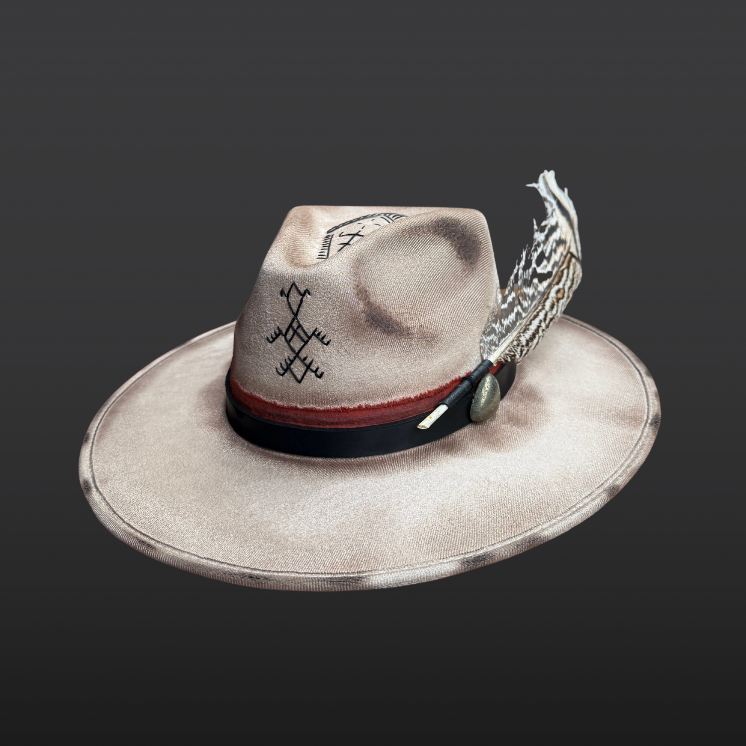 Ember Guardian wide brim fedora hat featuring torch-burned under-brim design, pyrite stone, and rust red band with black leather accents.