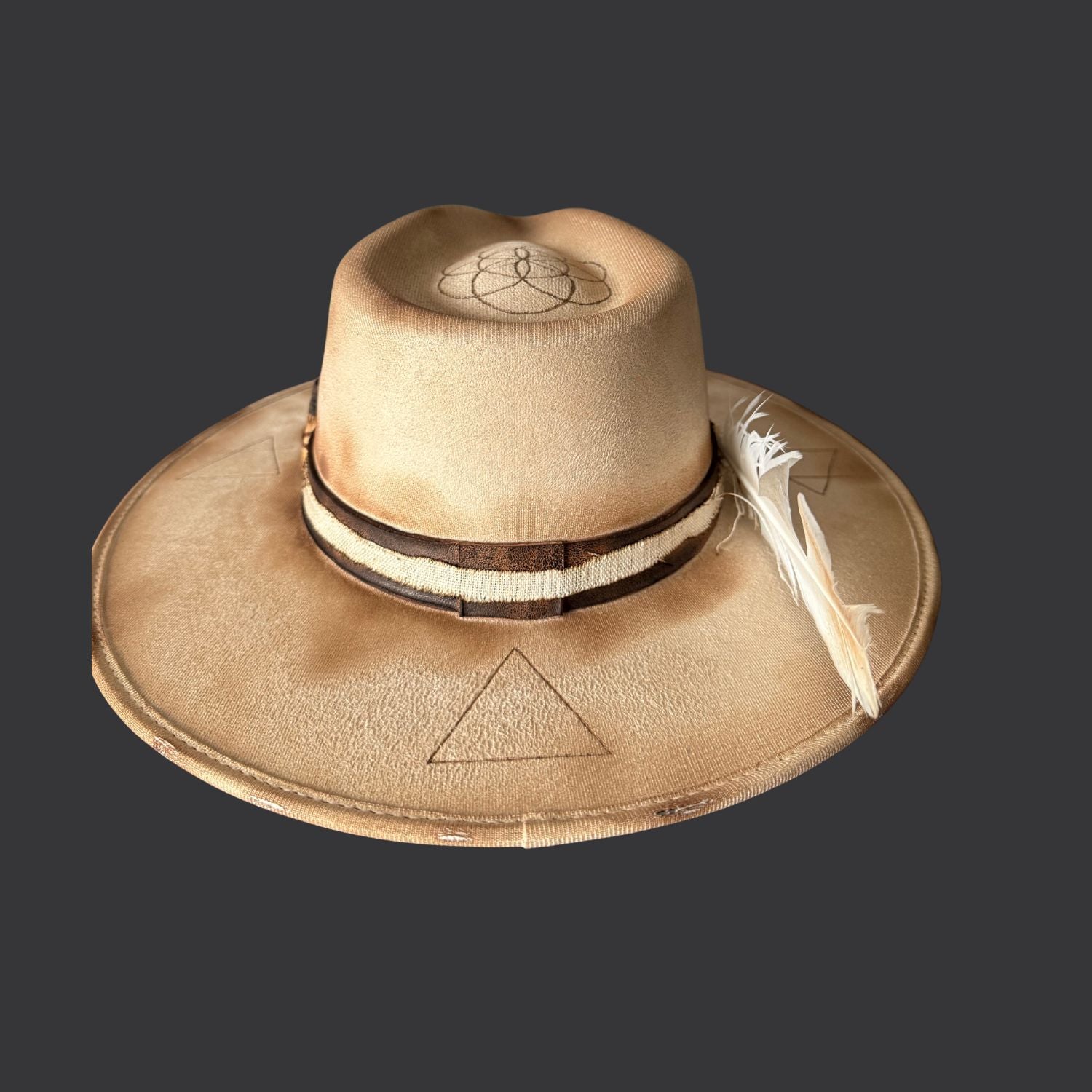 Cream wide-brim vegan suede fedora with Seed of Life and Four Elements pyrography, brown leather band, feather, and crystal arrow /back side view