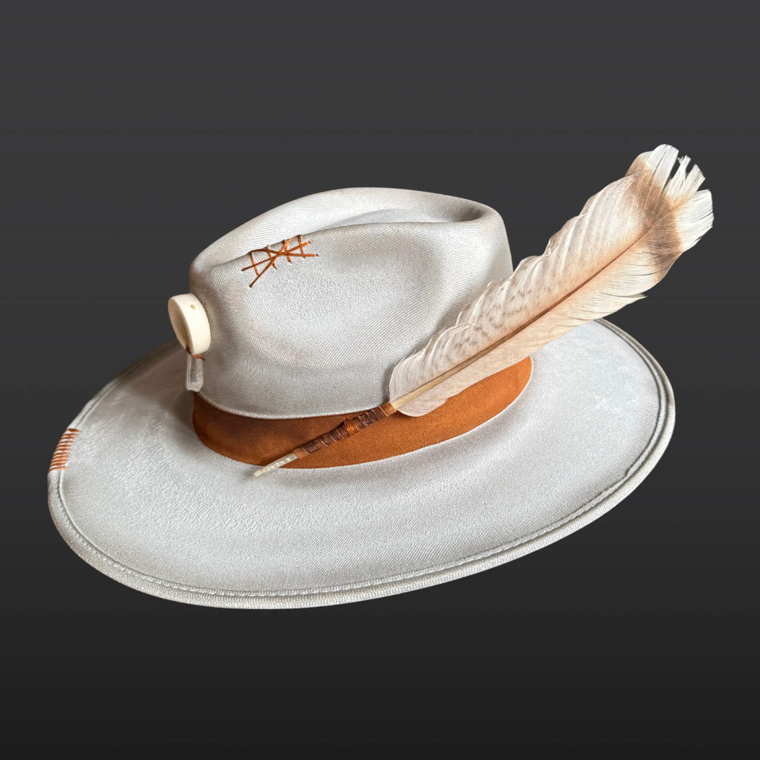 Right side of one-of-a-kind grey fedora with hand-burned detailing and embroidered accents