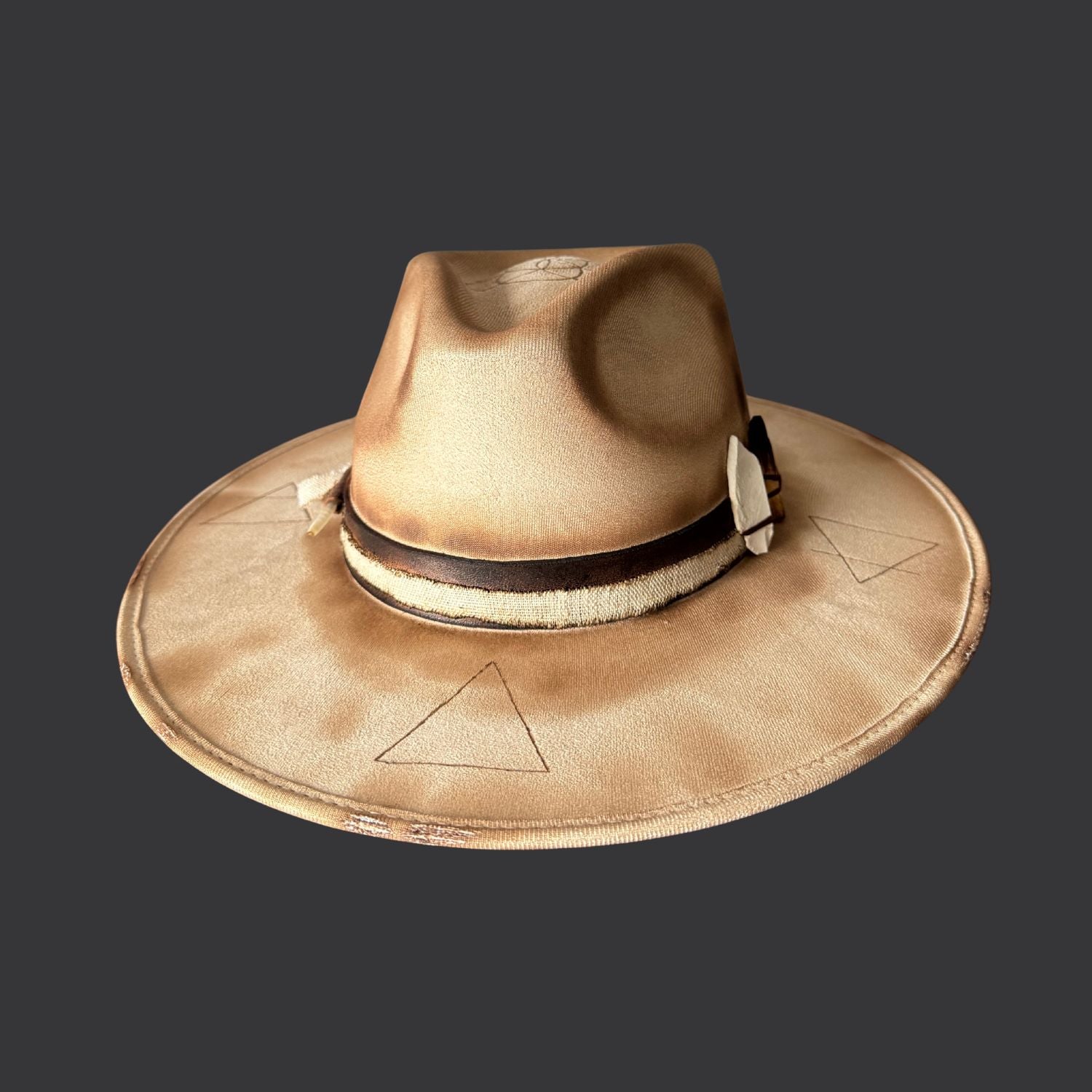 Cream wide-brim vegan suede fedora with Seed of Life and Four Elements pyrography, brown leather band, feather, and crystal arrow / front view