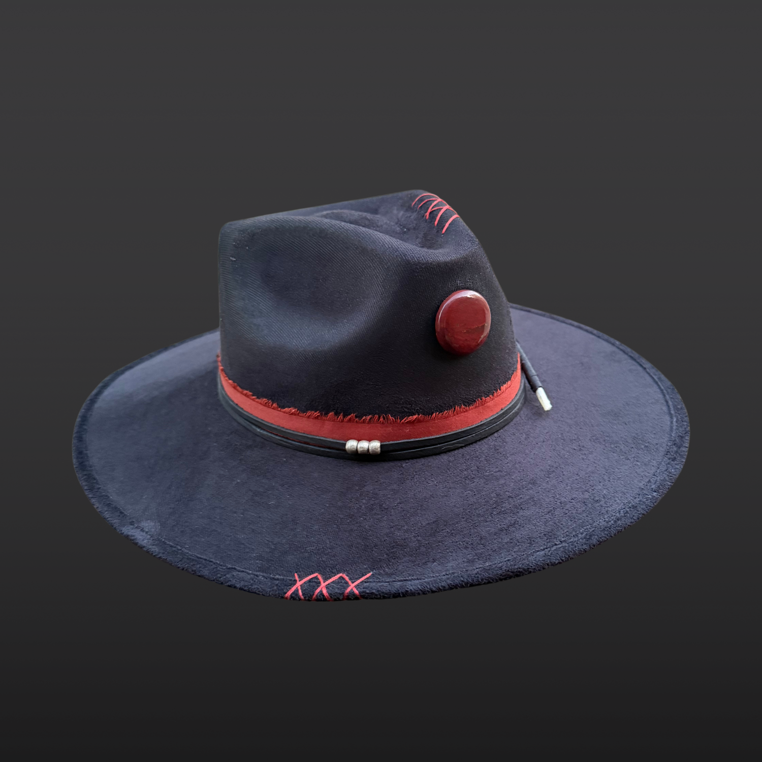 Black boho fedora hat with red jasper stone, hummingbird embroidery, and feather accent, left view by Inara Hat Co.