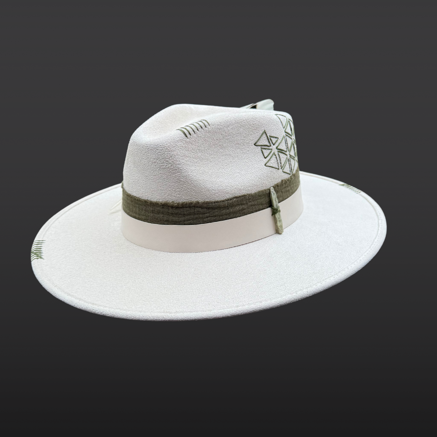 Front view of Delta Fedora Hat featuring olive green triangle embroidery and green kyanite crystal on an ivory fedora.