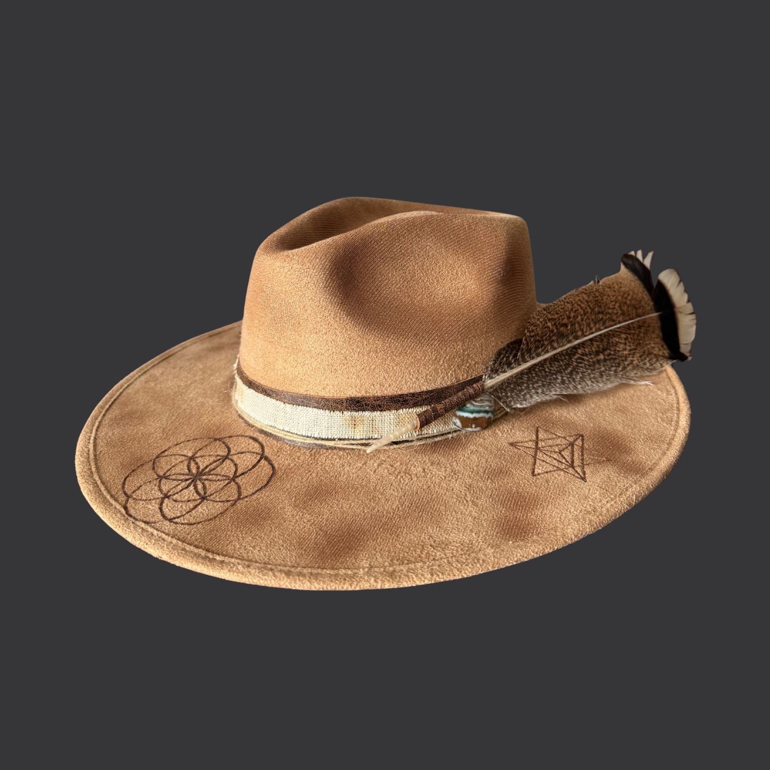 Camel boho fedora hat with hand burned Seed of Life design, agate crystal detail, and dark brown leather band / left side view