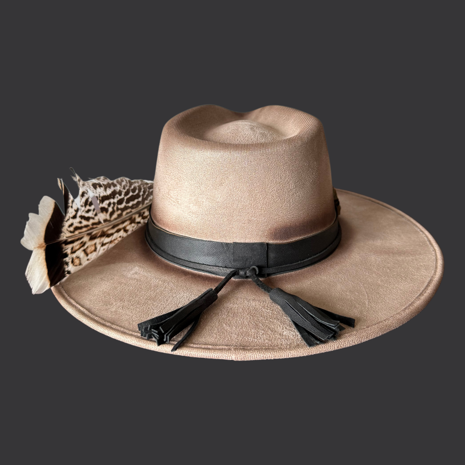 Back view of khaki wide-brim fedora hat with chalcopyrite crystal and black leather tassels