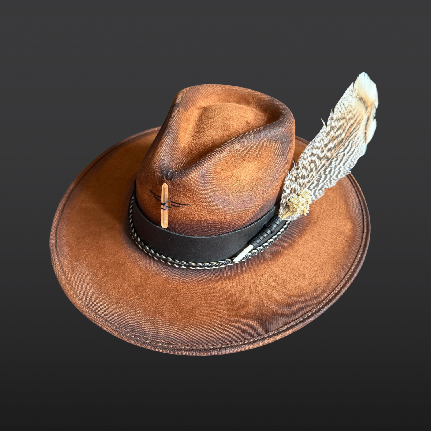 Side view of Wild in the Woods wide brim fedora hat showing black leather band and hand-torched tobacco suede