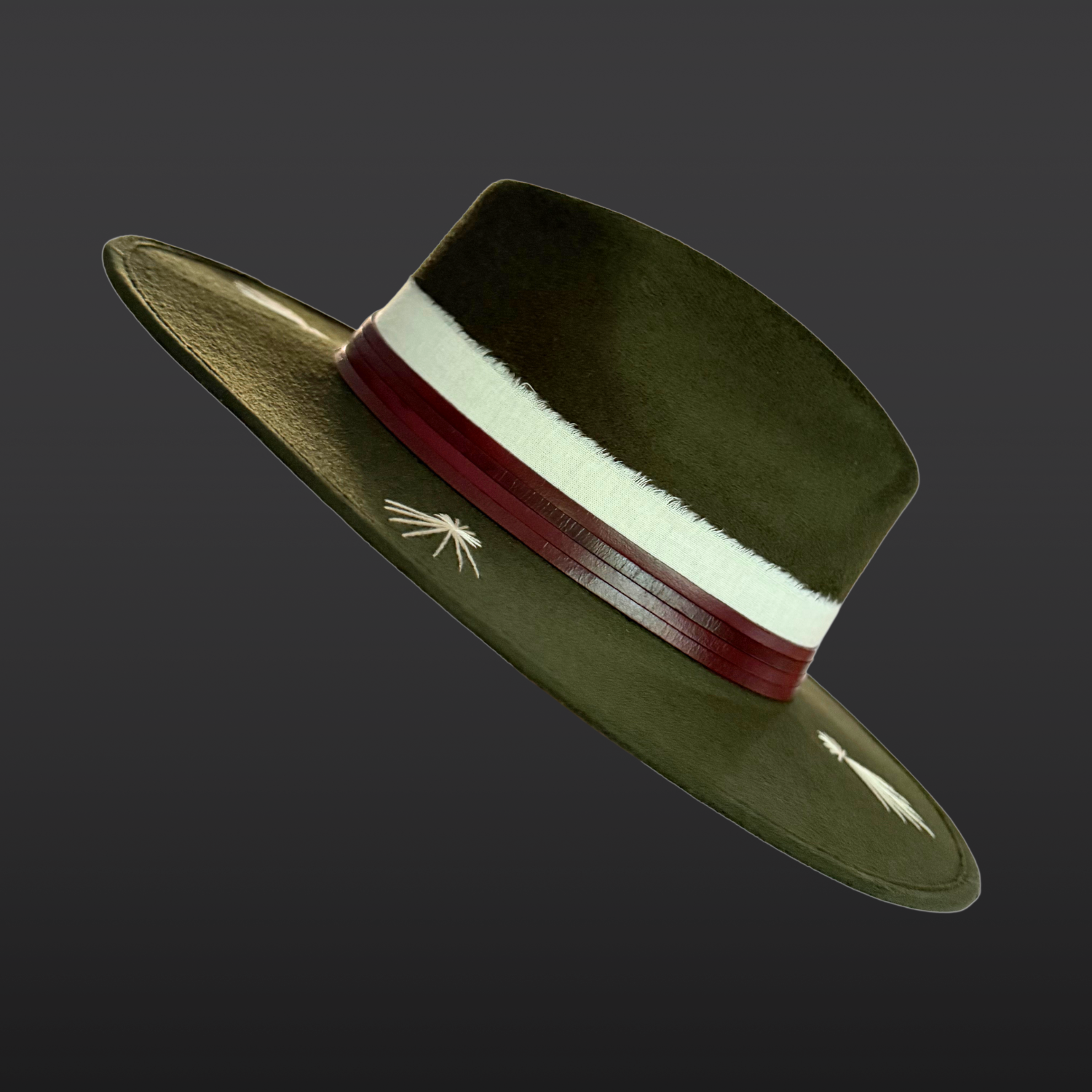 Right Side view of Kindred forest green fedora hat with ivory embroidery, leather band and fossil ammonite
