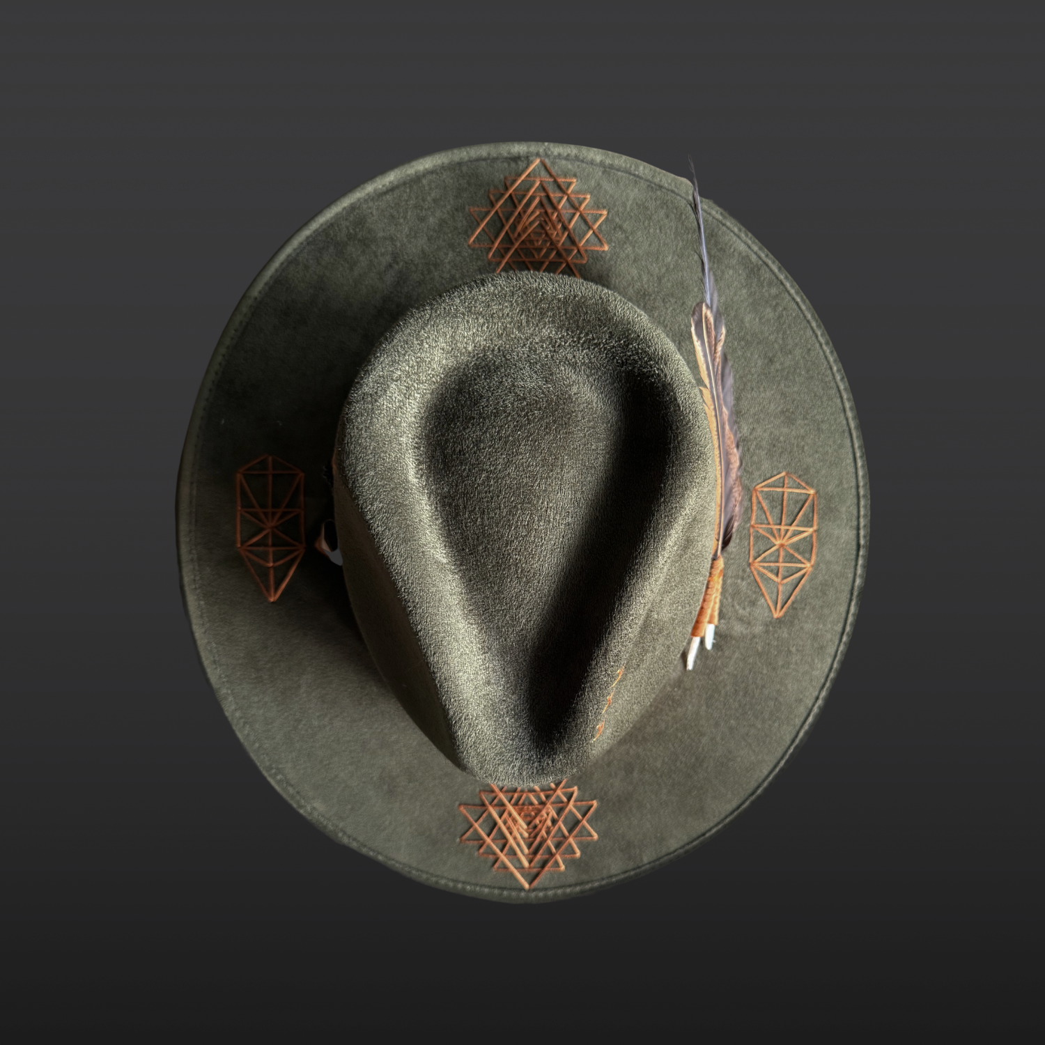 Top view of the Root & Radiance forest green fedora showing sacred geometry embroidery across the brim