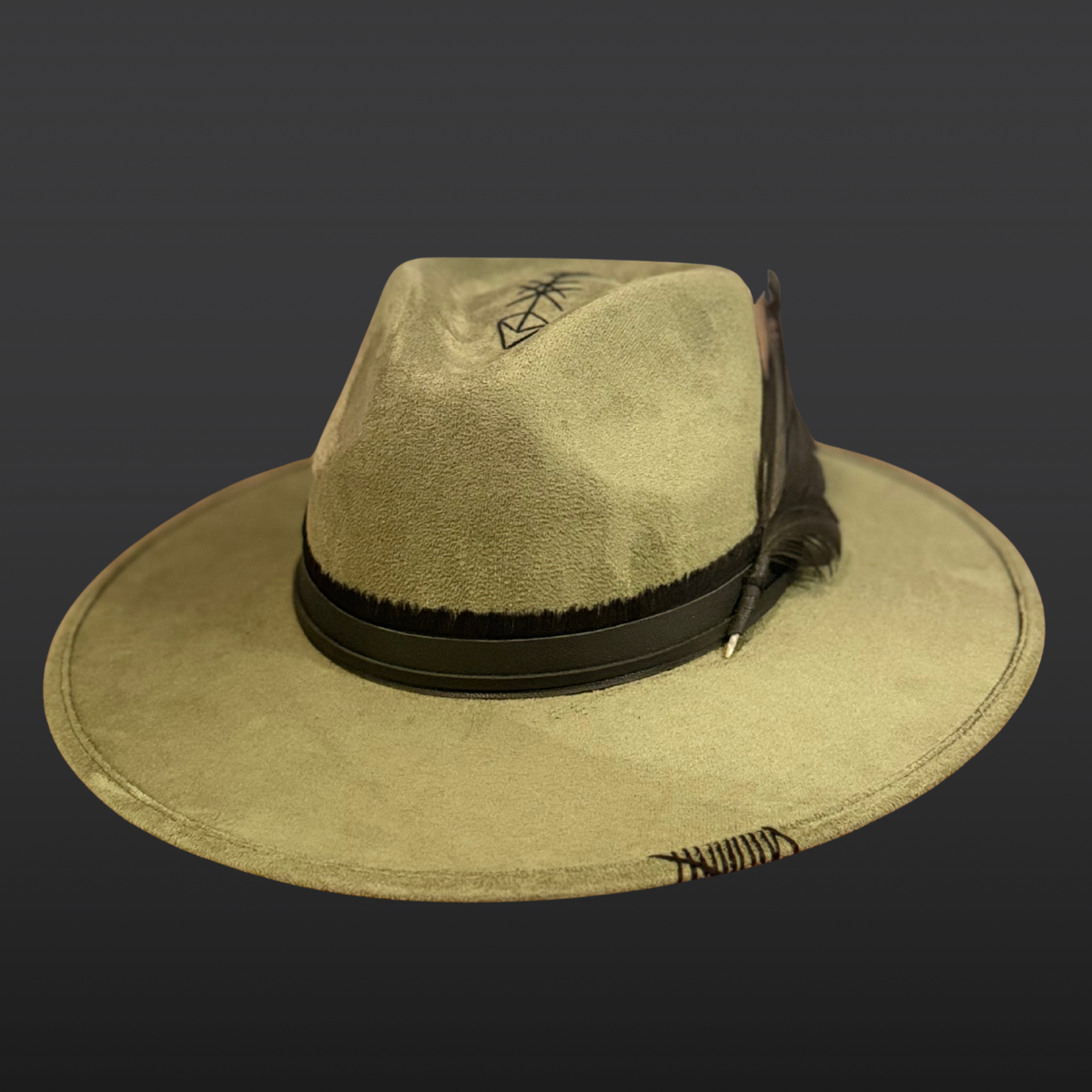Front view: A sage green wide-brimmed fedora with a hand-embroidered arrow design, black obsidian arrow stone, and black leather band.