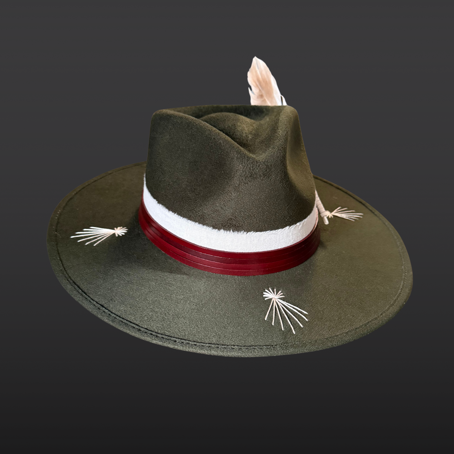 Front view of Kindred forest green fedora hat with ivory embroidery, leather band and fossil ammonite