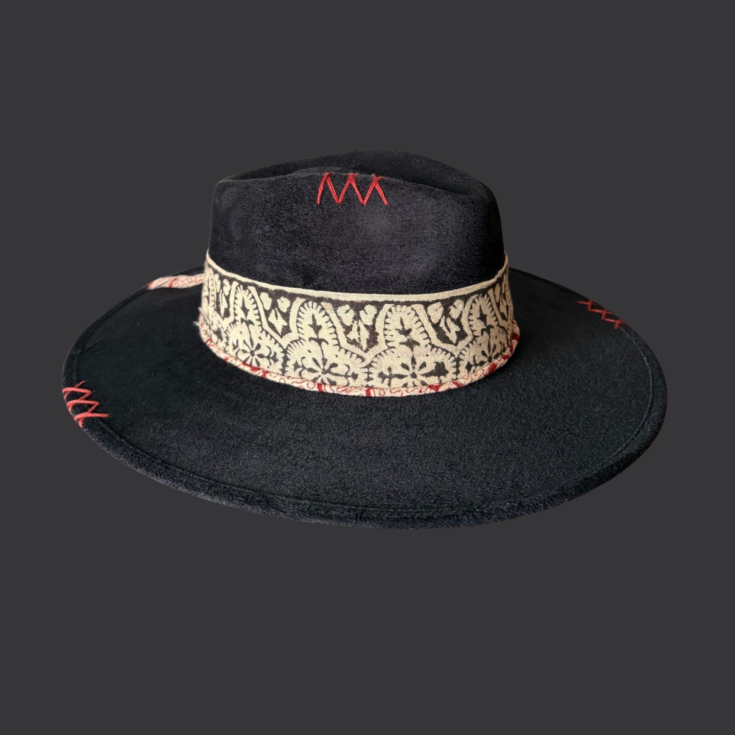Left view of one of a kind black fedora hat with red jasper, embroidered details, and feather accents
