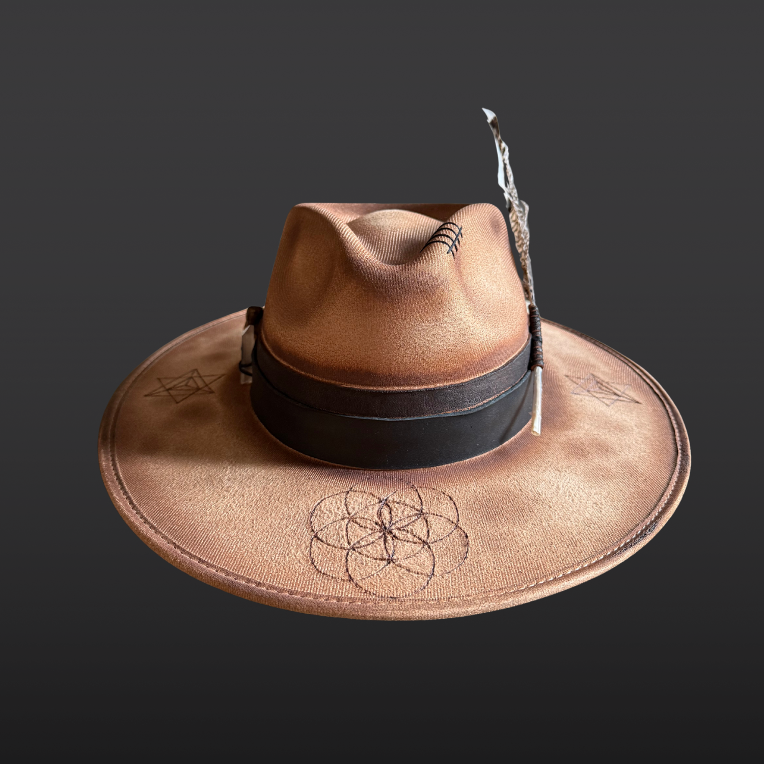 Front view of Firekeeper camel artisan fedora featuring hand-burned Seed of Life and Merkaba sacred geometry
