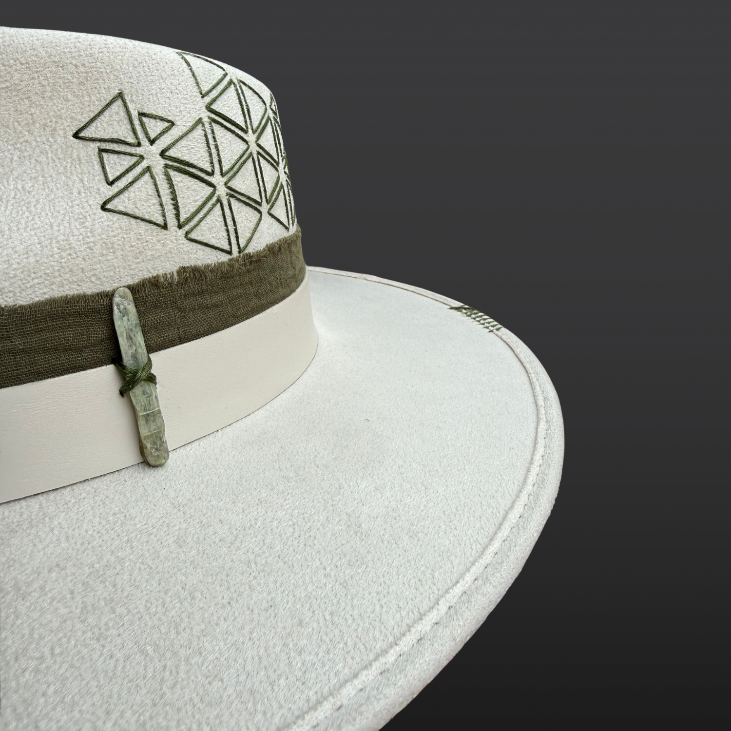 Close-up of sacred geometry embroidery, green kyanite crystal detail on the Delta Fedora Hat.
