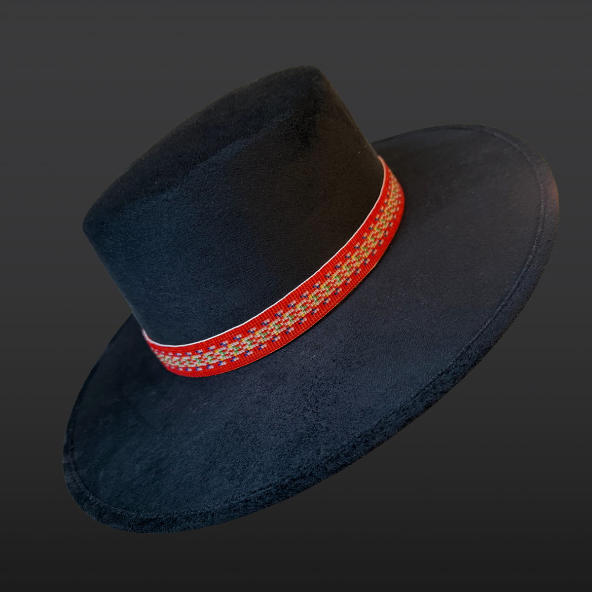 Black cordobés hat with Red River Métis beaded sash by Winnipeg Métis artist, honoring waterways, ancestry, and resilience / agled front view