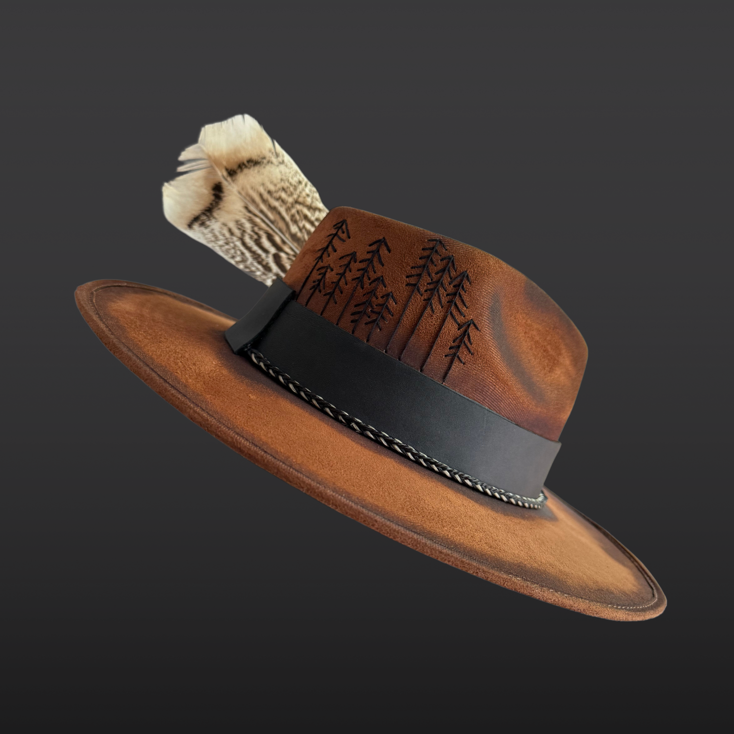 Close-up of hand-embroidered pine tree details on Wild in the Woods tobacco suede fedora hat