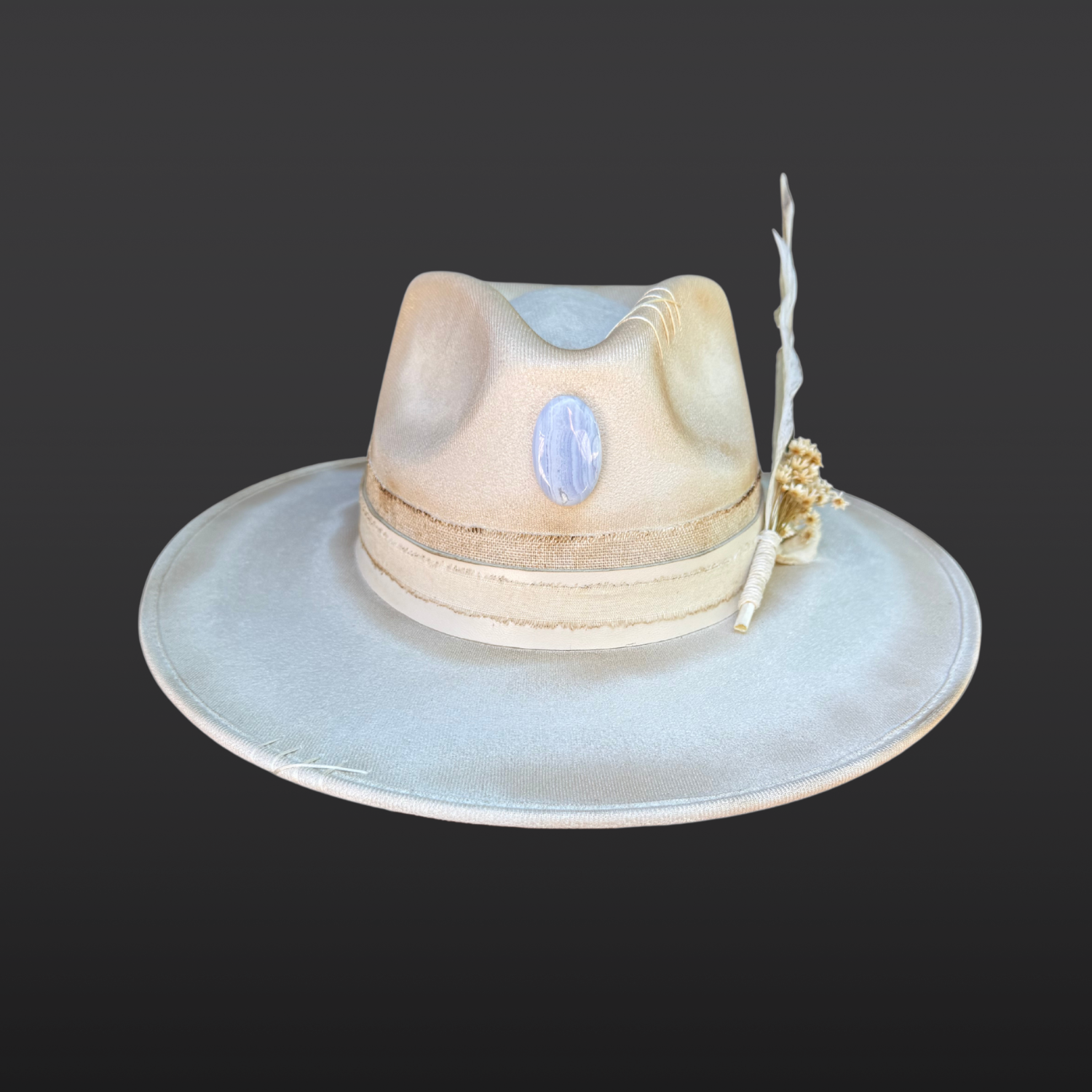 Lunar Bloom ivory wide brim fedora with blue lace agate crystal, ivory leather bands, hand embroidered details, and floral turkey feather.