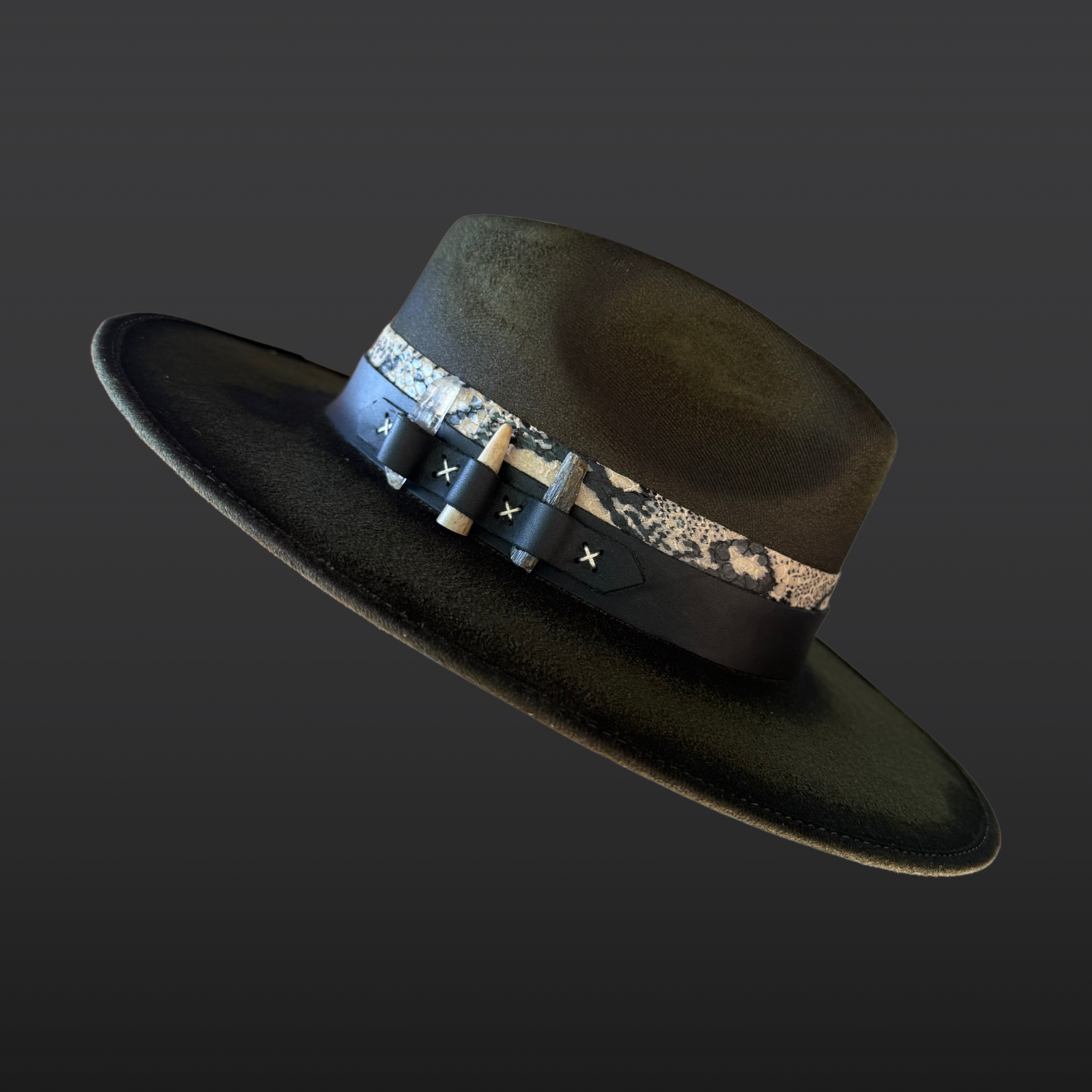 Dark green wide-brim fedora featuring hand-burned artwork, serpent-print leather, green kyanite, Lemurian quartz, and a naturally shed deer antler.
