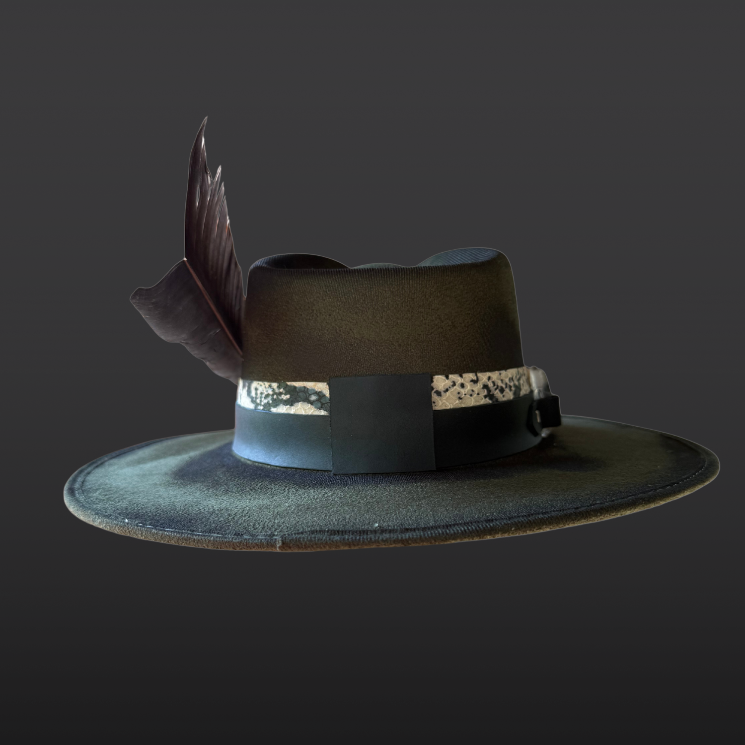Back view of the Verdant Viper hat highlighting the dark green vegan suede and layered leather band details.