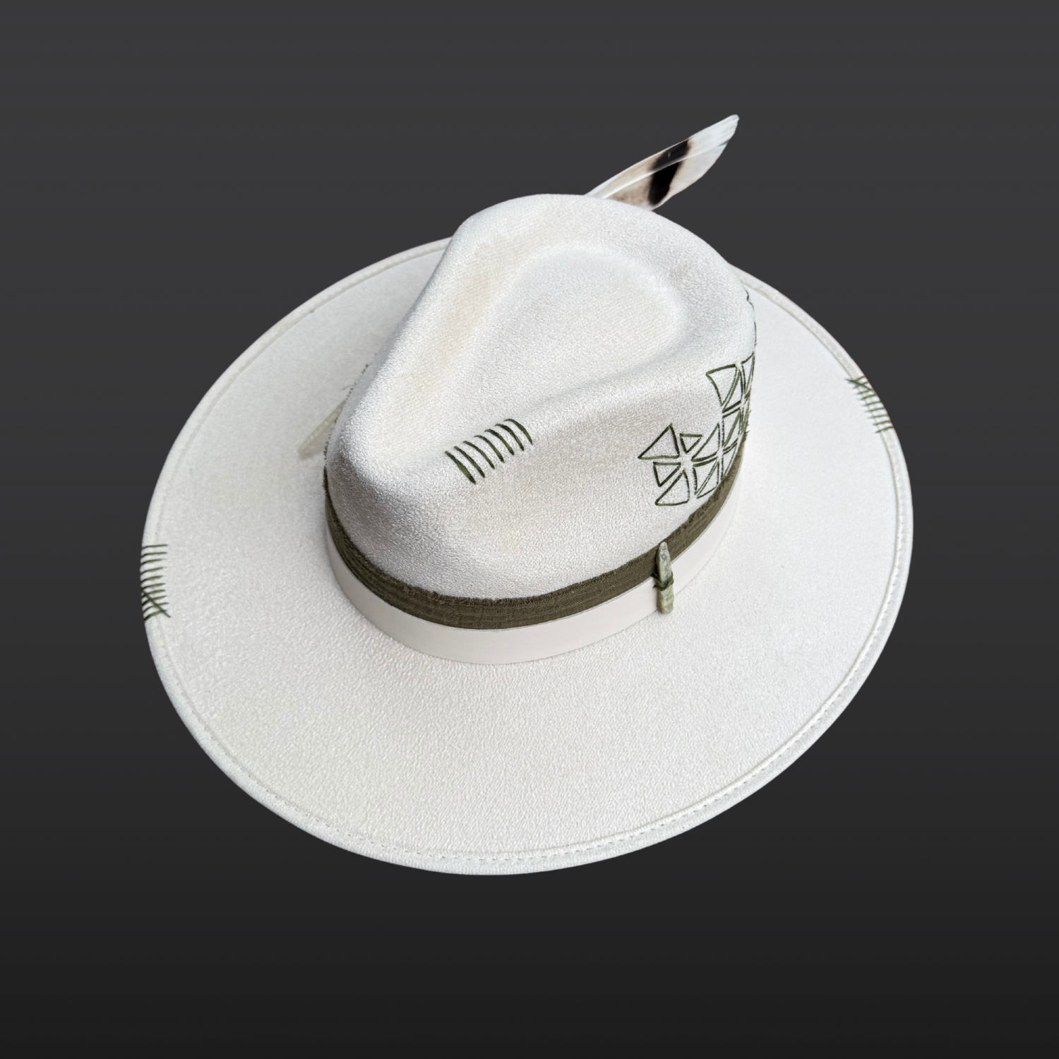 Angled view of Delta Fedora Hat with olive green cotton band, ivory leather accent band, and geometric embroidery.