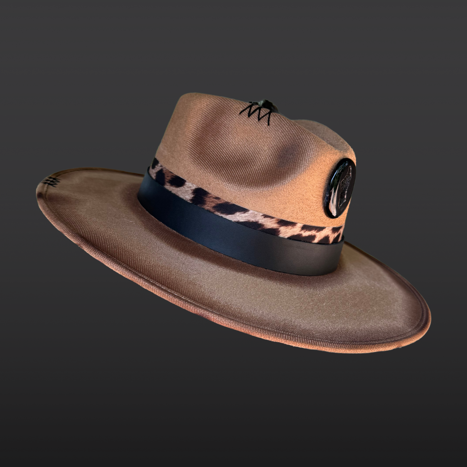 Side view of the Shadow Jaguar fedora showcasing the black agate onyx druzy, crow feathers, and layered leather bands.