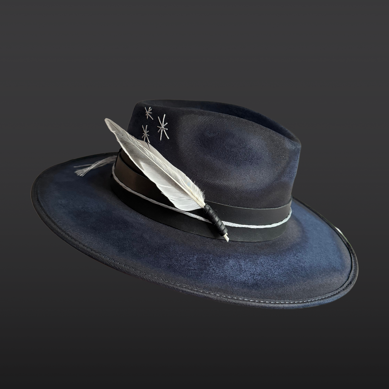Side profile of the Celestial Alignment Fedora Hat showing eight quartz crystal points, silver accents, and white and silver feather details.