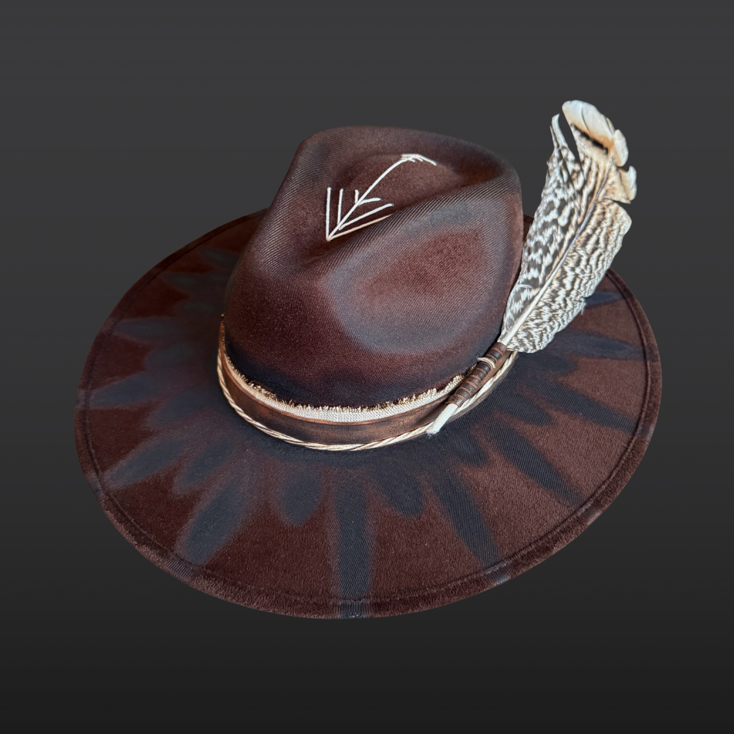 Right Side profile of brown wide brim fedora hat showing feather embellishment, torch-burned detailing, and handcrafted boho design