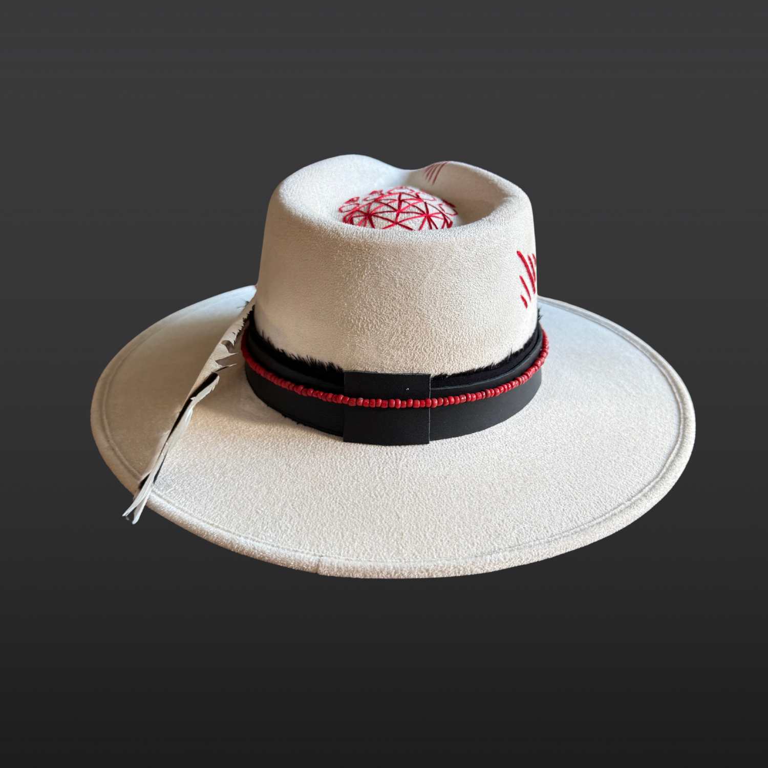 Back side view of Ivory vegan suede fedora with a black hat band and red bead accents.